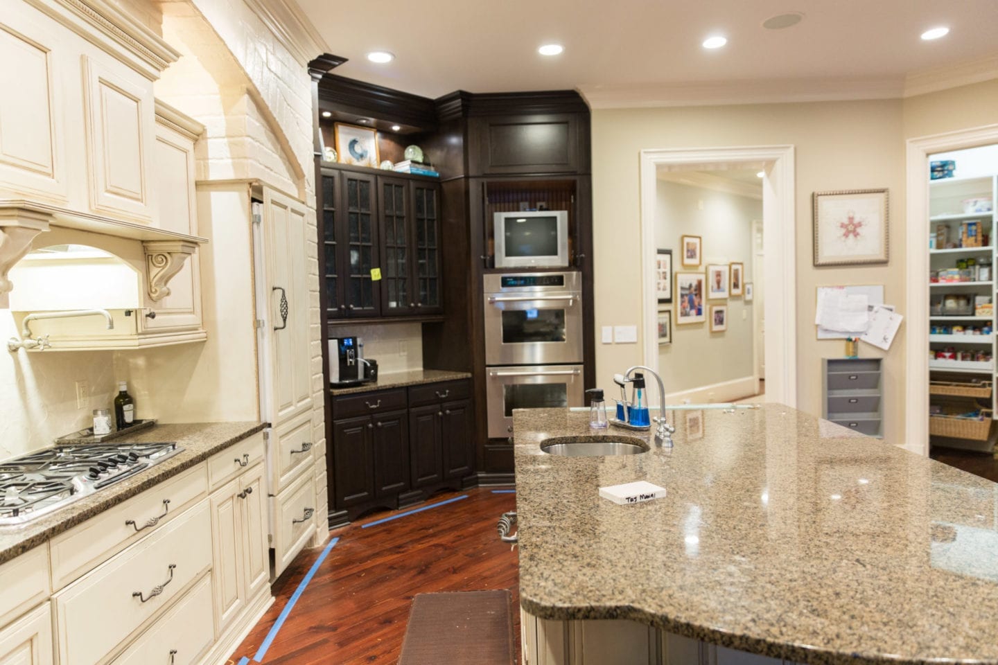 Kitchen remodel before and after. TV in kitchen with granite countertops.