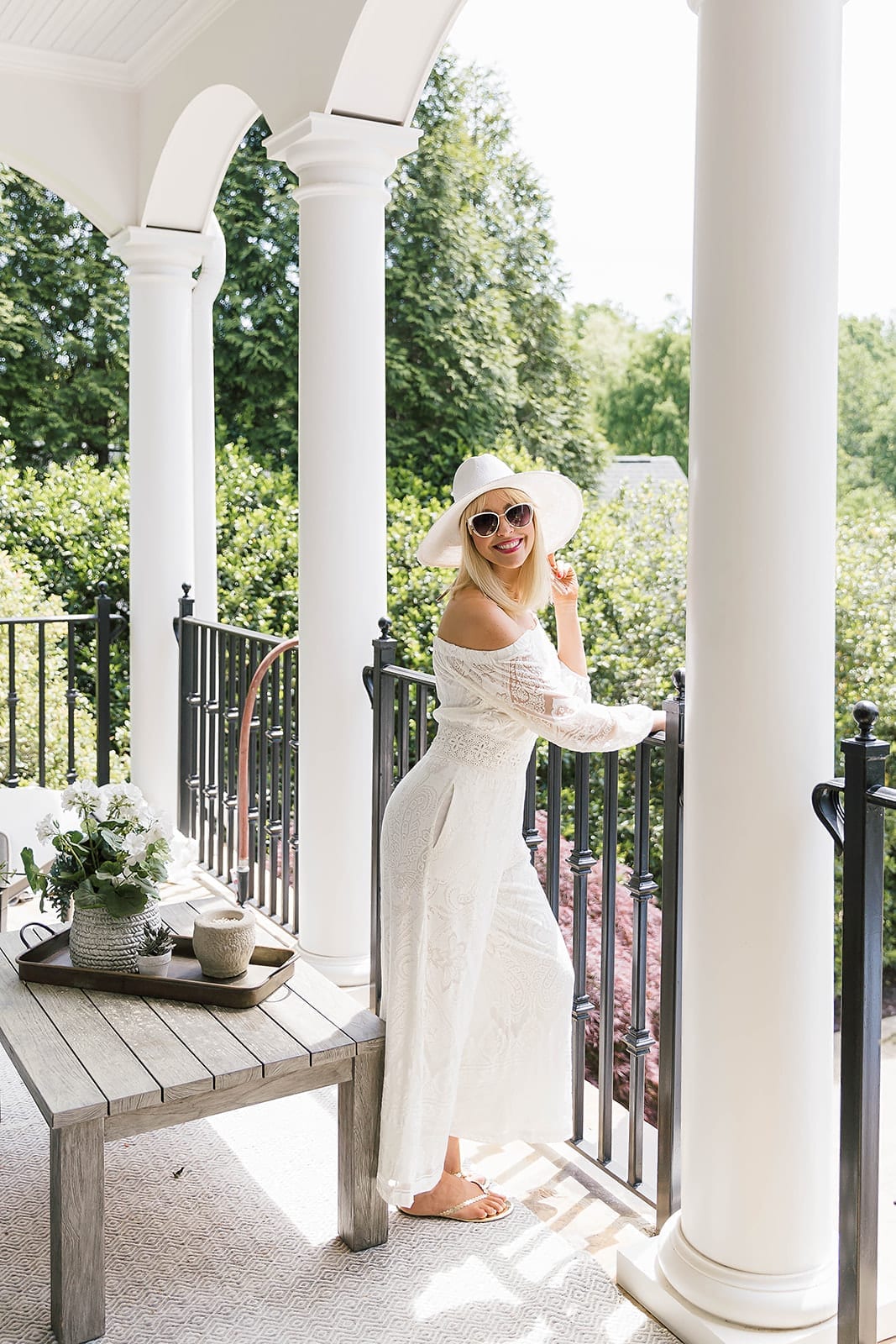 White inexpensive sunglasses with white hat and all white outfit.