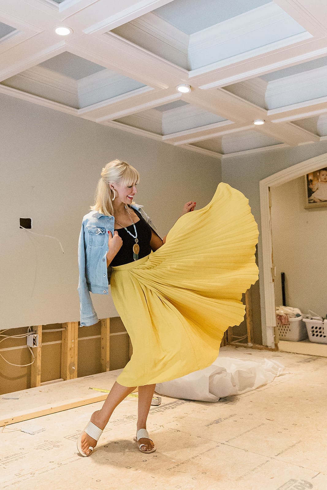 How to wear a jean jacket with a skirt outfit. Summer sandals and brightly colored skirt with light blue jean jacket.