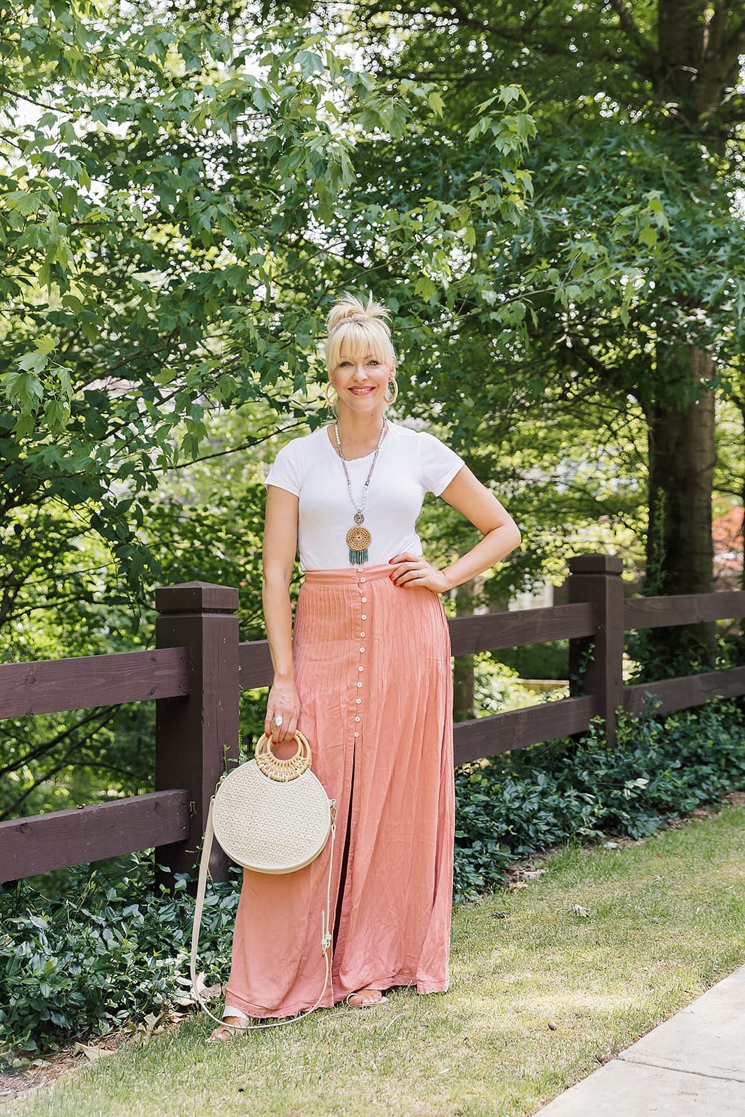Skirt Vacation Outfit. Easy to pack skirt that won't wrinkle with a versatile bodysuit you can wear with everything. Great travel crossbody bag.