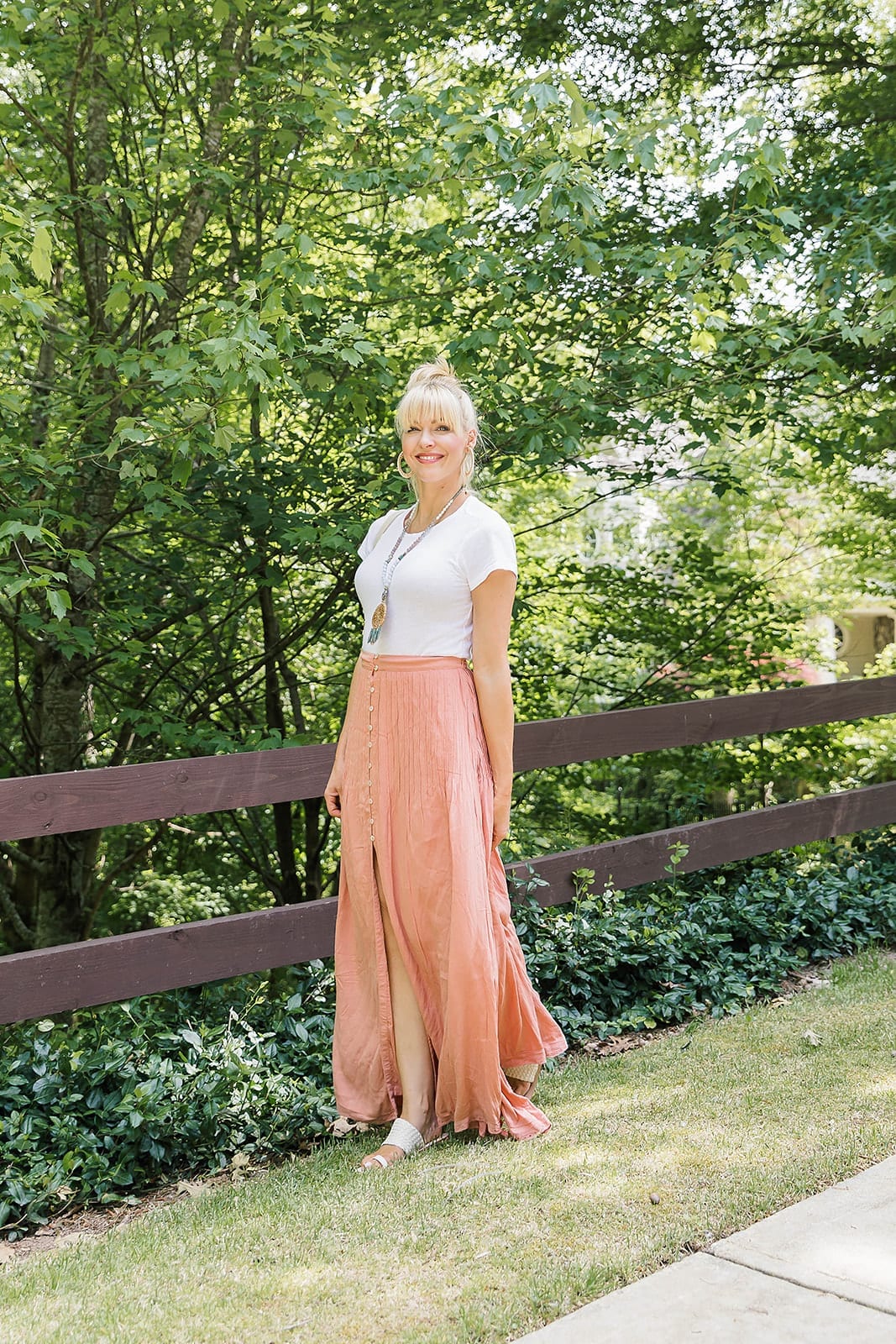 Pleated Maxi Skirt for summer fashion. Pretty color maxi skirt with white bodysuit and summer hairstyle.