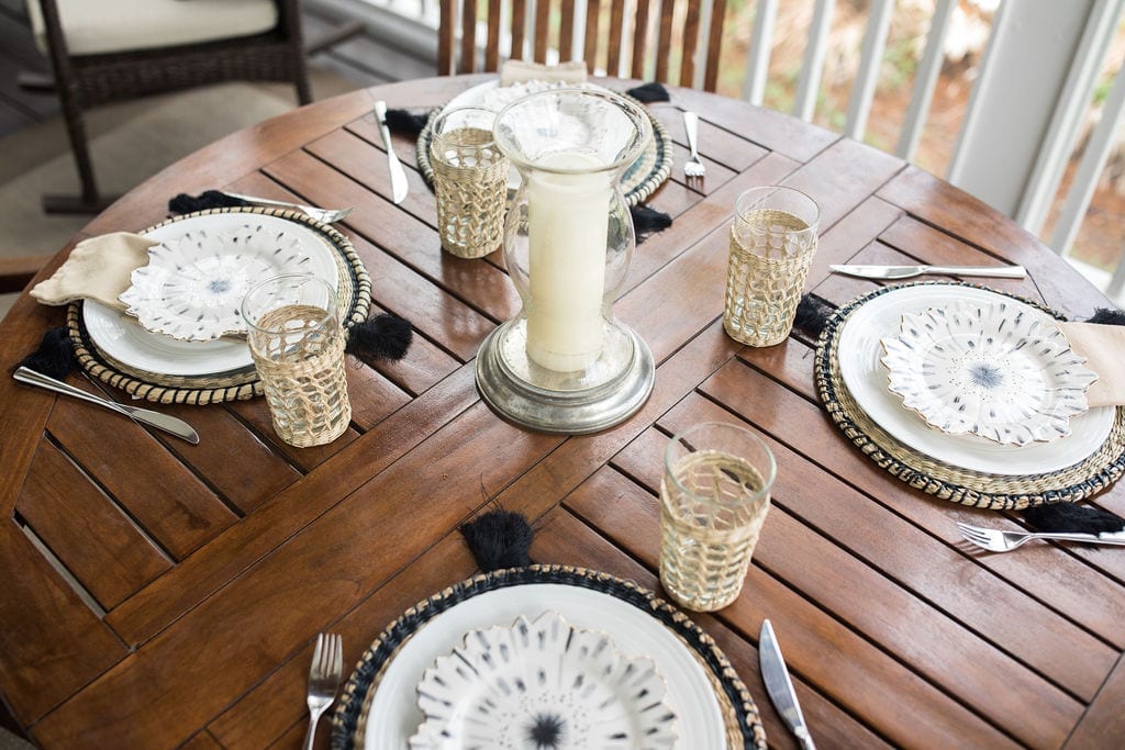 Gold and black table decor. Elegant, easy, summer table centerpiece for a round outdoor dining table.