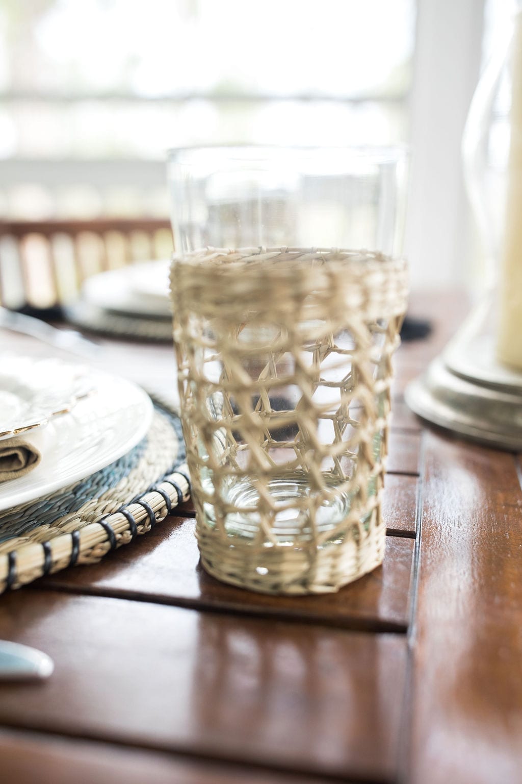 Wicker cup holder for outdoor summer parties and outdoor entertaining with wicker decor.
