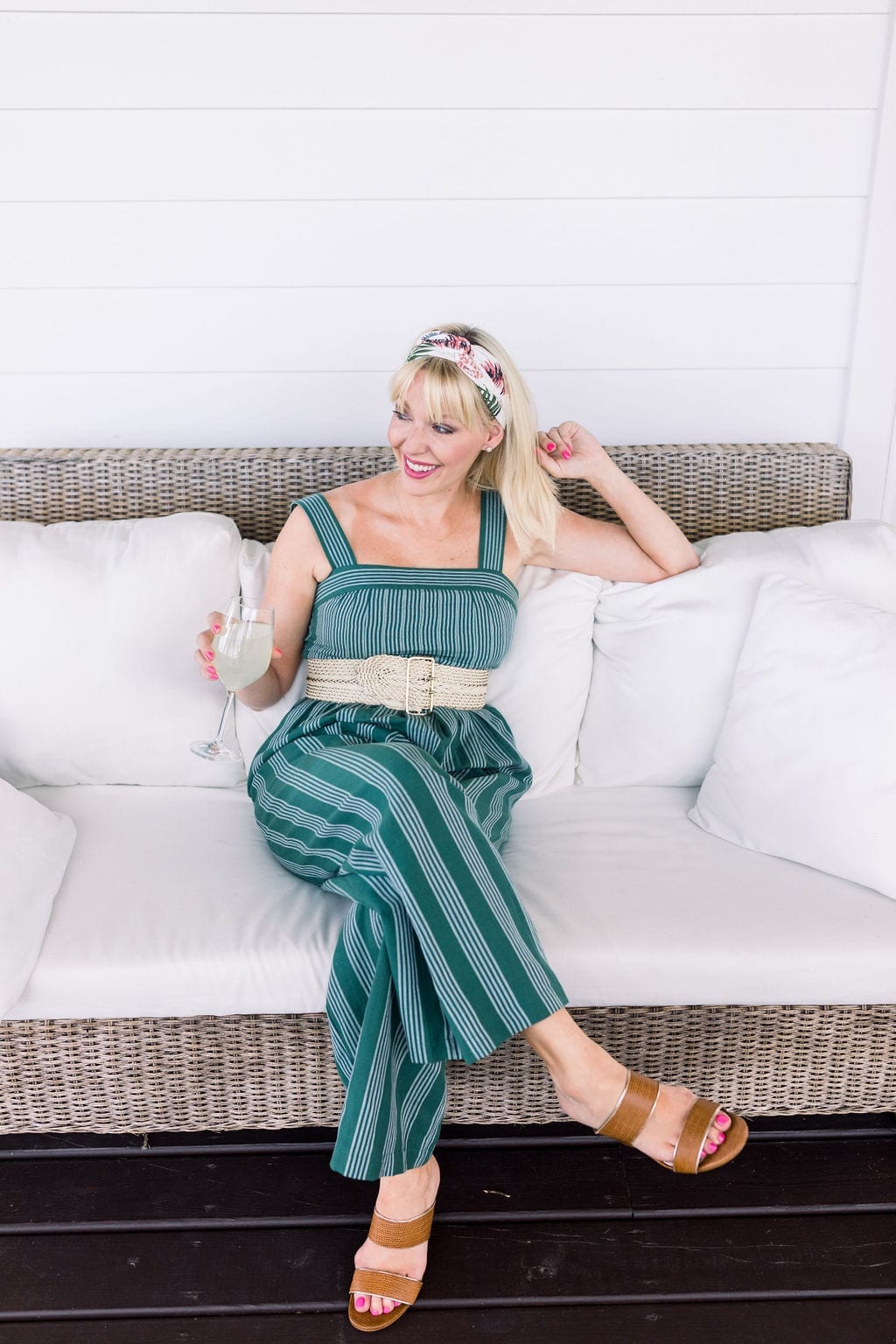 Anthropologie Headscarf in gorgeous pink and green florals. How to wear a headscarf with bangs and pair with a summer jumpsuit and brown sandals.