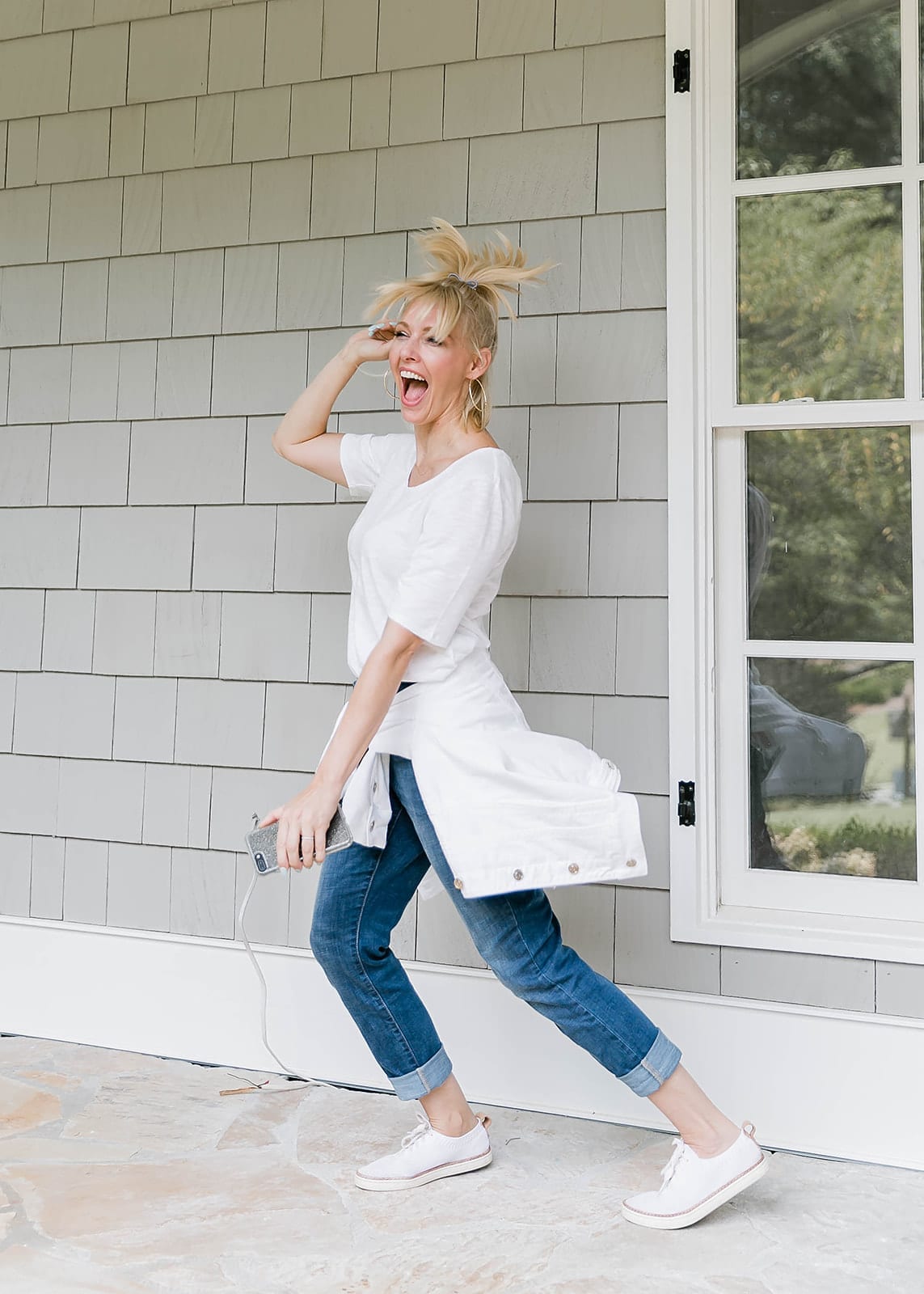 Blue Gray Gal dancing white Chicos Slub Tee, white jean jacket and girlfriend jeans.