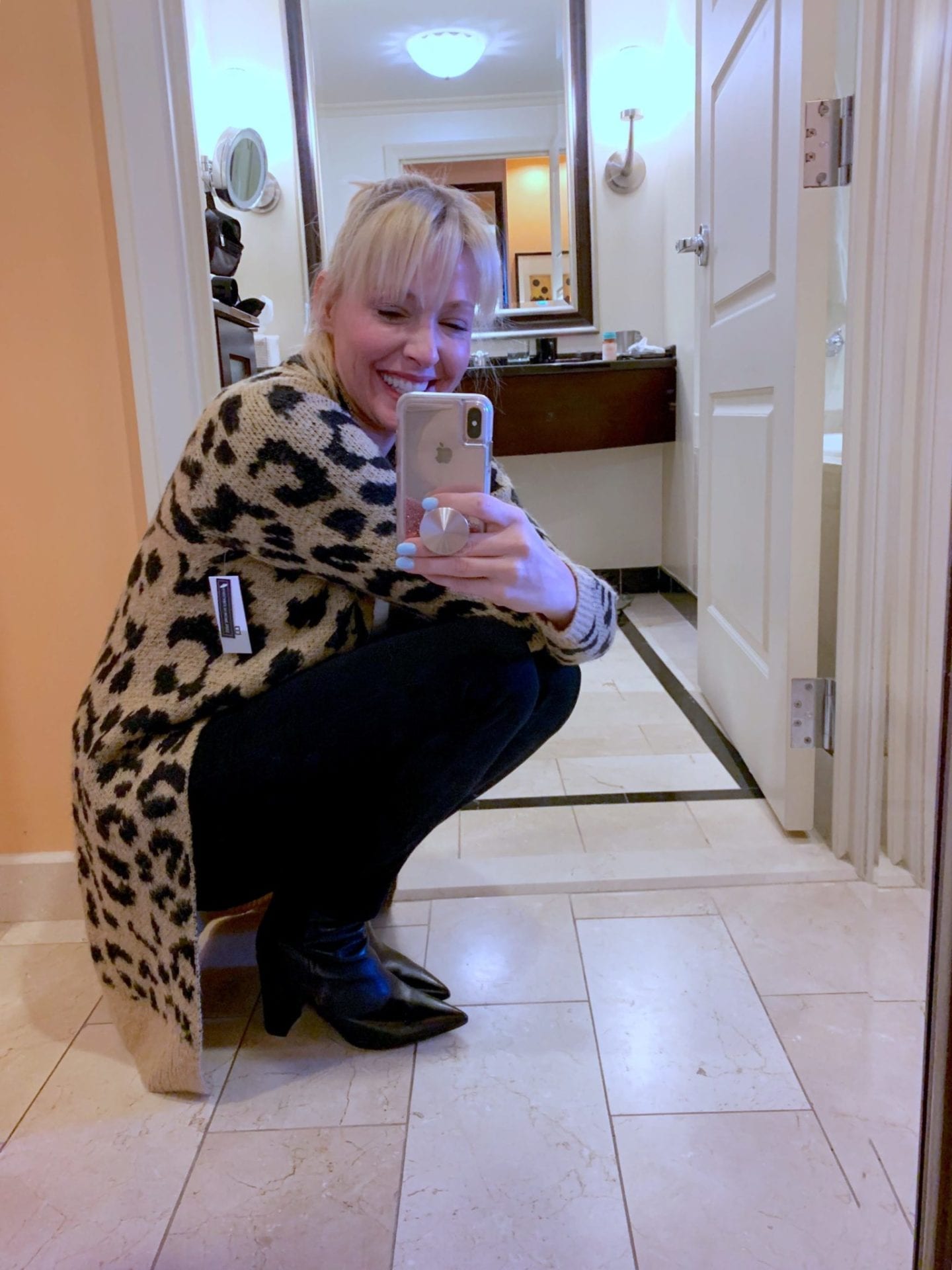 Leopard Cardigan on sale with black jeans and black booties.