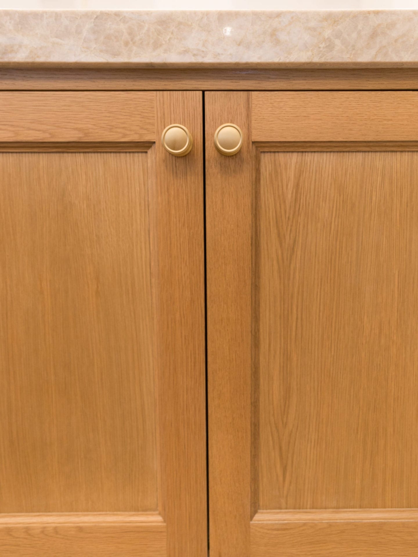 VESTA hardware Knobs on oak kitchen cabinets.
