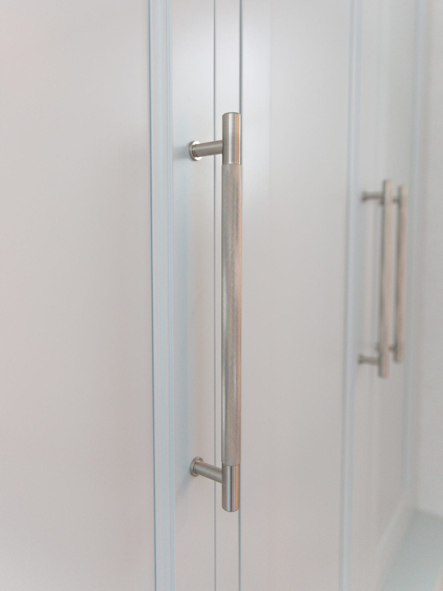 Knurled pulls with satin nickel finish. Masculine and modern pulls for cabinetry.