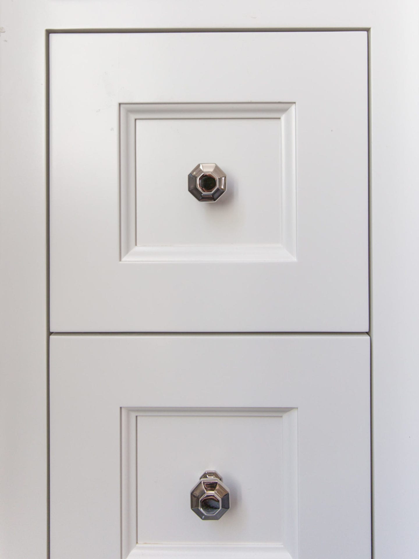 Unique pulls for bathroom. Hexagon pulls in polished nickel.