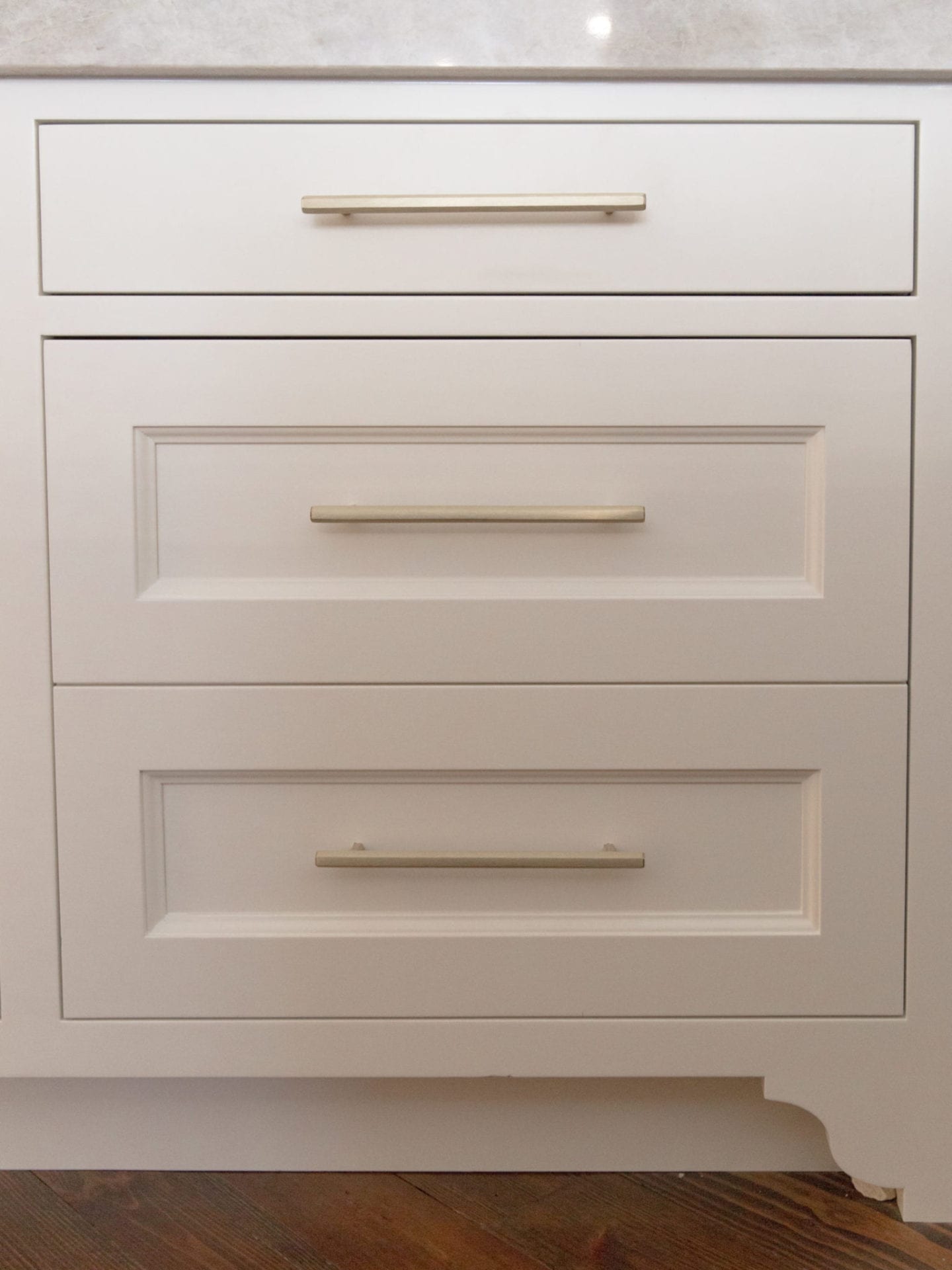 Luxury Hardware made by VESTA hardware. White Dove paint color for cabinetry with quartzite countertop in Taj Majal.