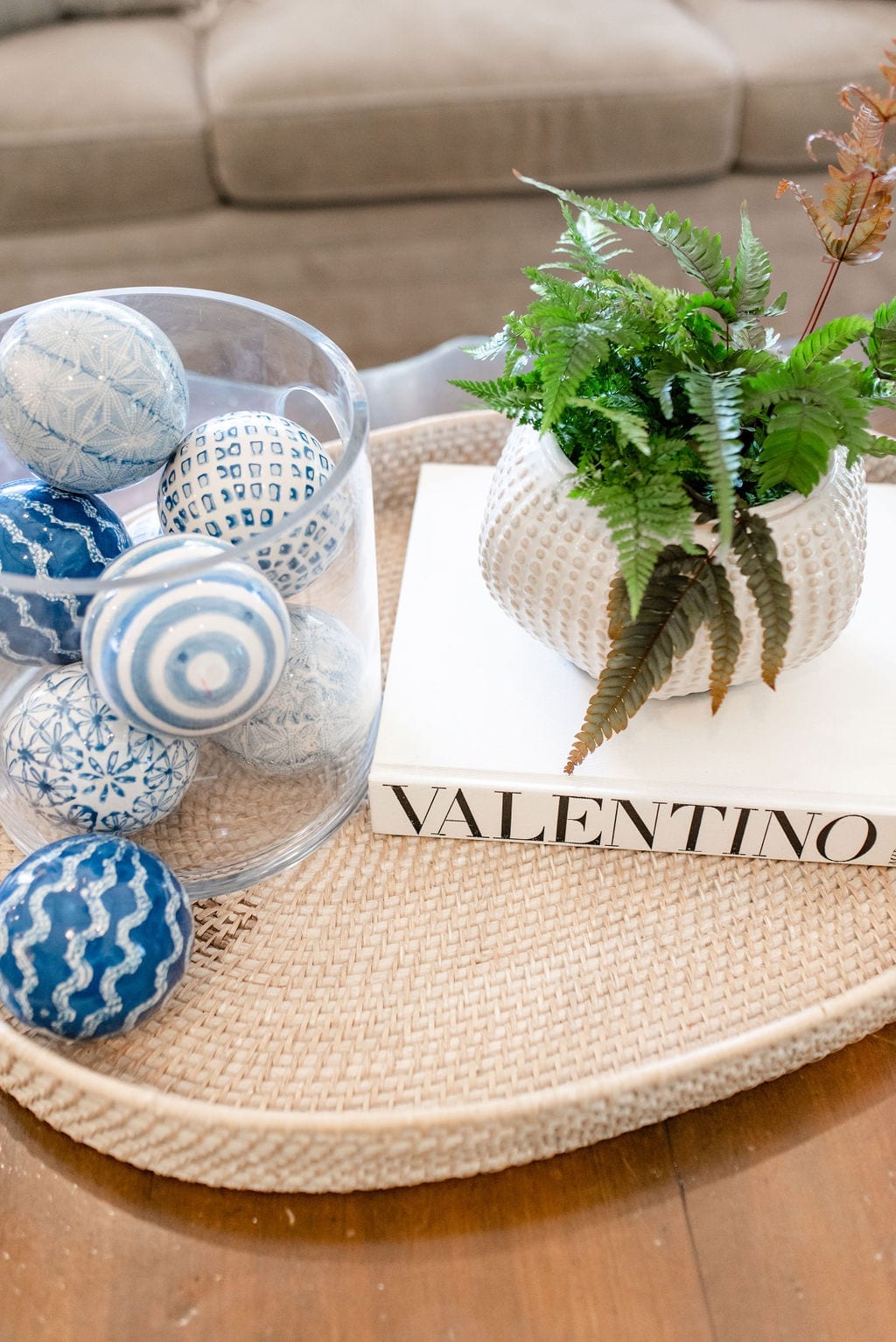 Wicker Oval Tray with coffee table decorations for family room.