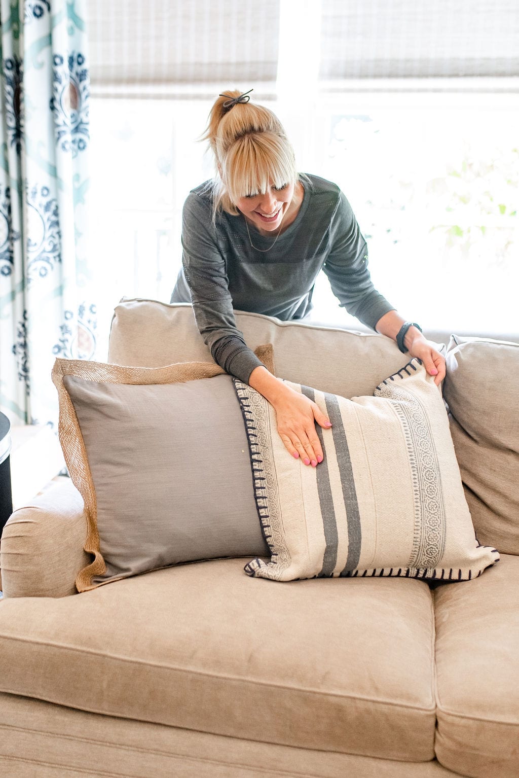 Embroidered stripe throw pillows. Love this blue and white throw pillow from Wayfair! Tips to change up your couch and family look colors without a big budget!
