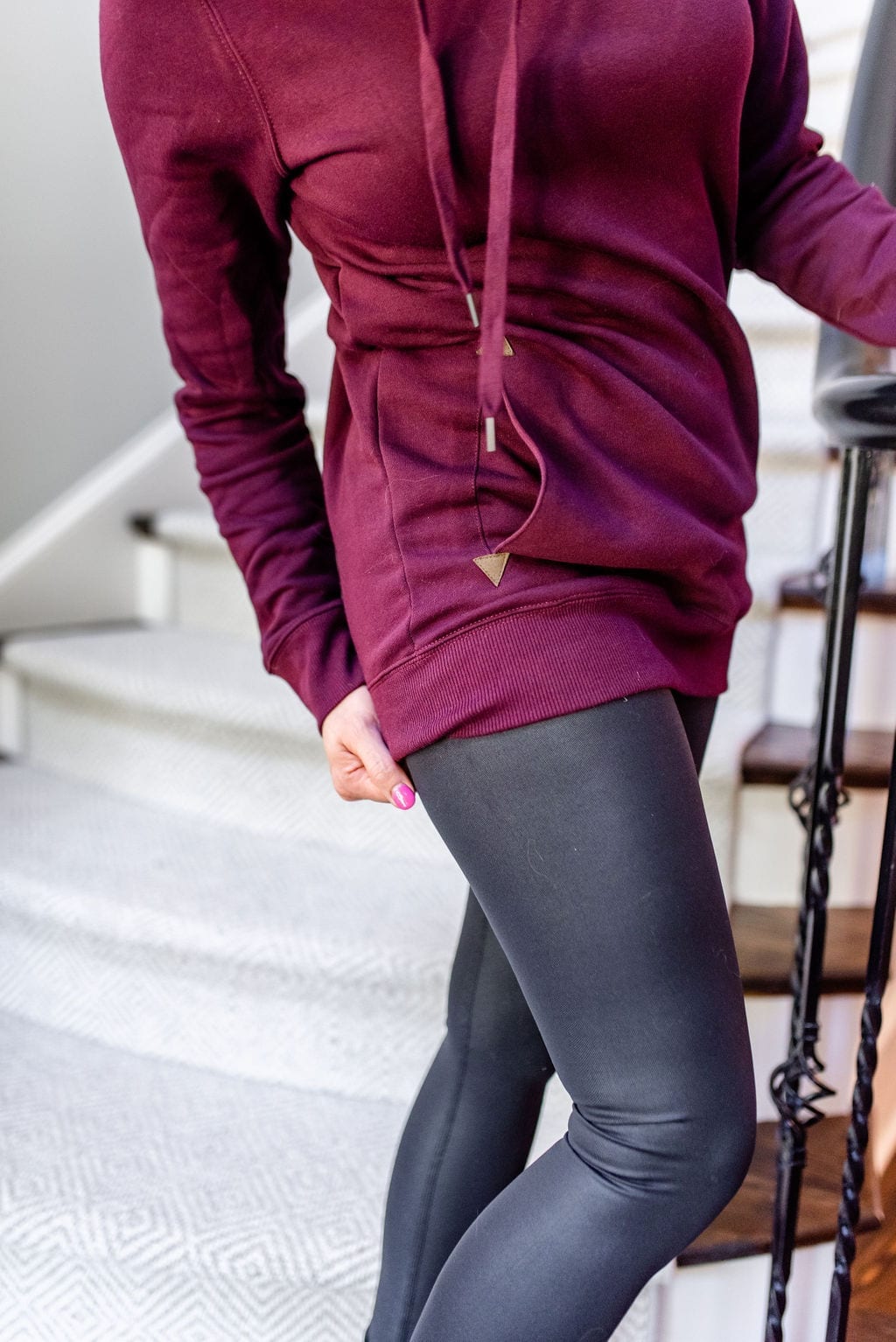 Long sweatshirt hoodie in dark maroon color with shiny yoga pants.