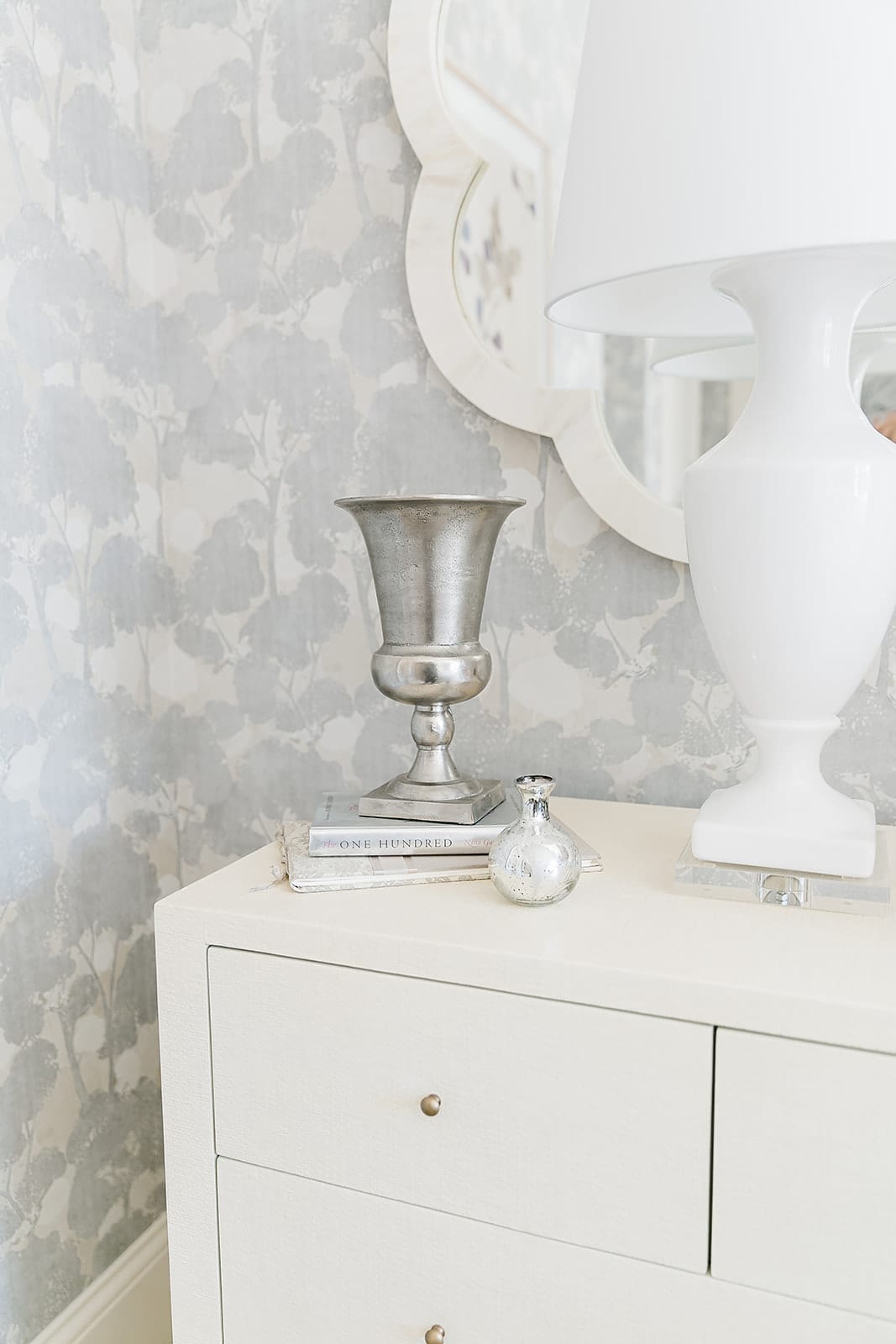 Mercury Glass Decorations on bedroom nightstand. Mixing metals with white home accessories.
