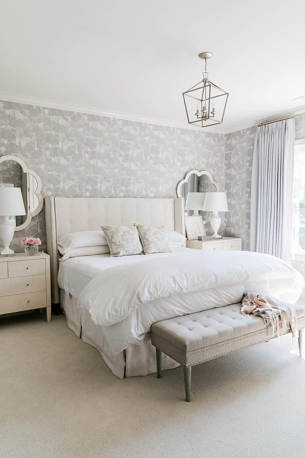 Guest bedroom makeover. Lavender floral wallpaper, white hotel sheets, Madegoods dresser and custom headboard from Calico.