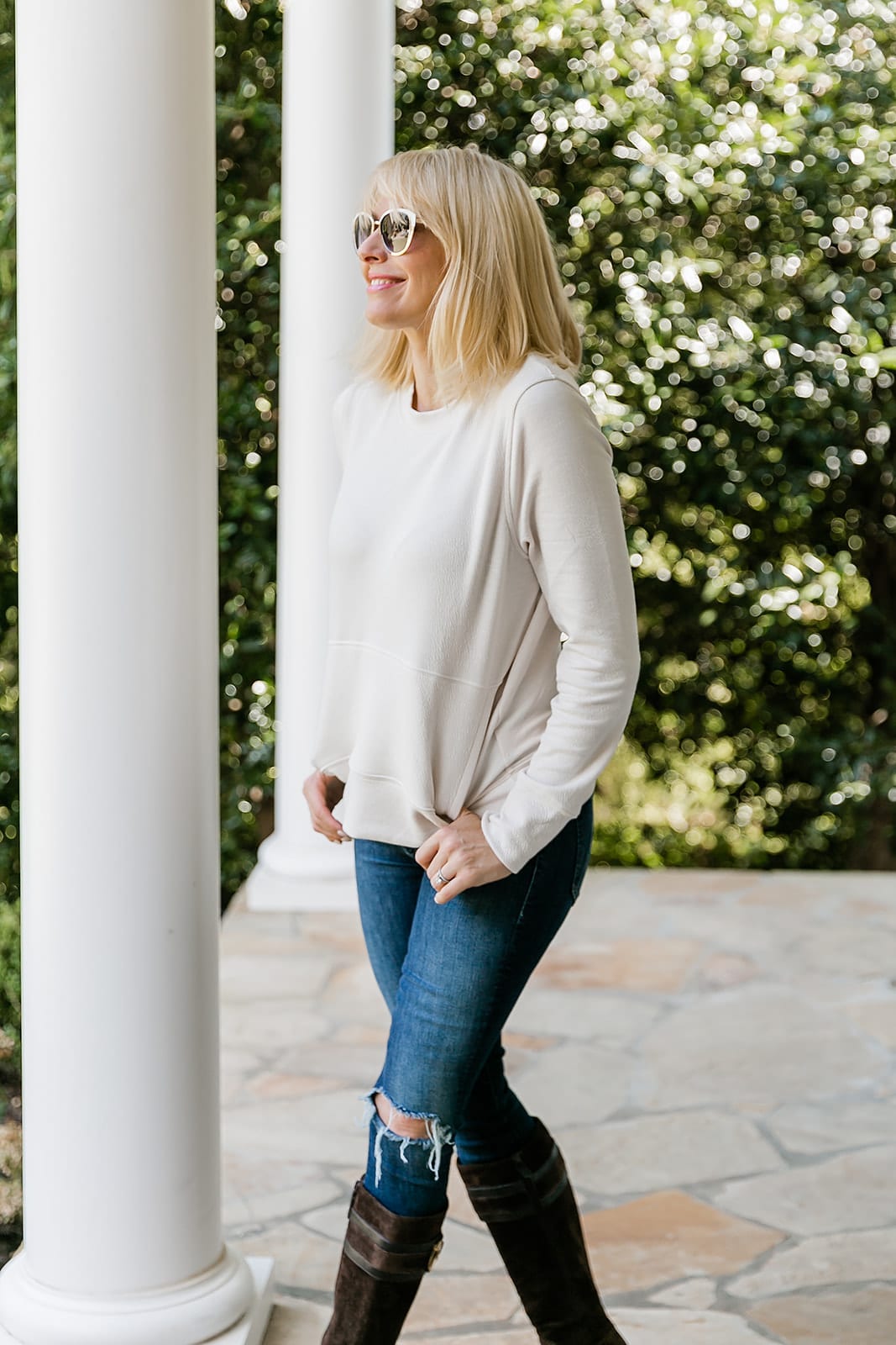 Ivory Sweatshirt and brown suede knee high boots fall outfit.