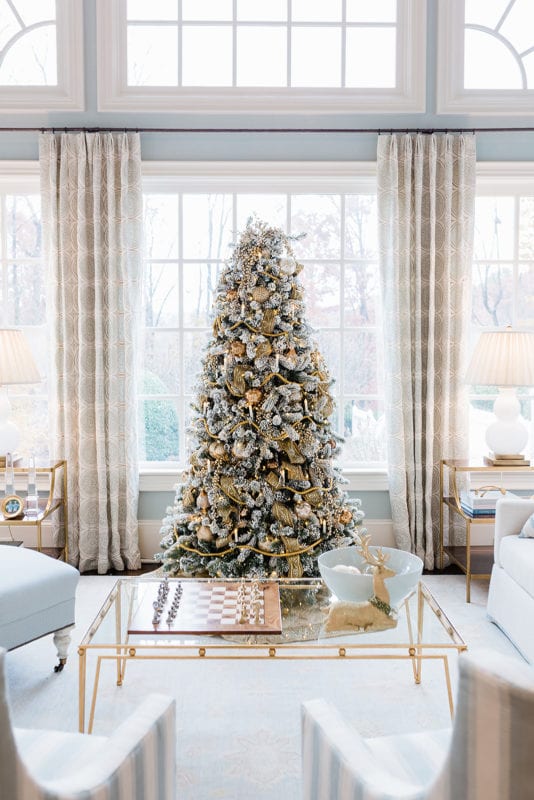 Gold Flocked Christmas Tree decorated by home blogger Kelly Page, for BlueGrayGal. Soft blue and gray living room with gold Christmas tree.