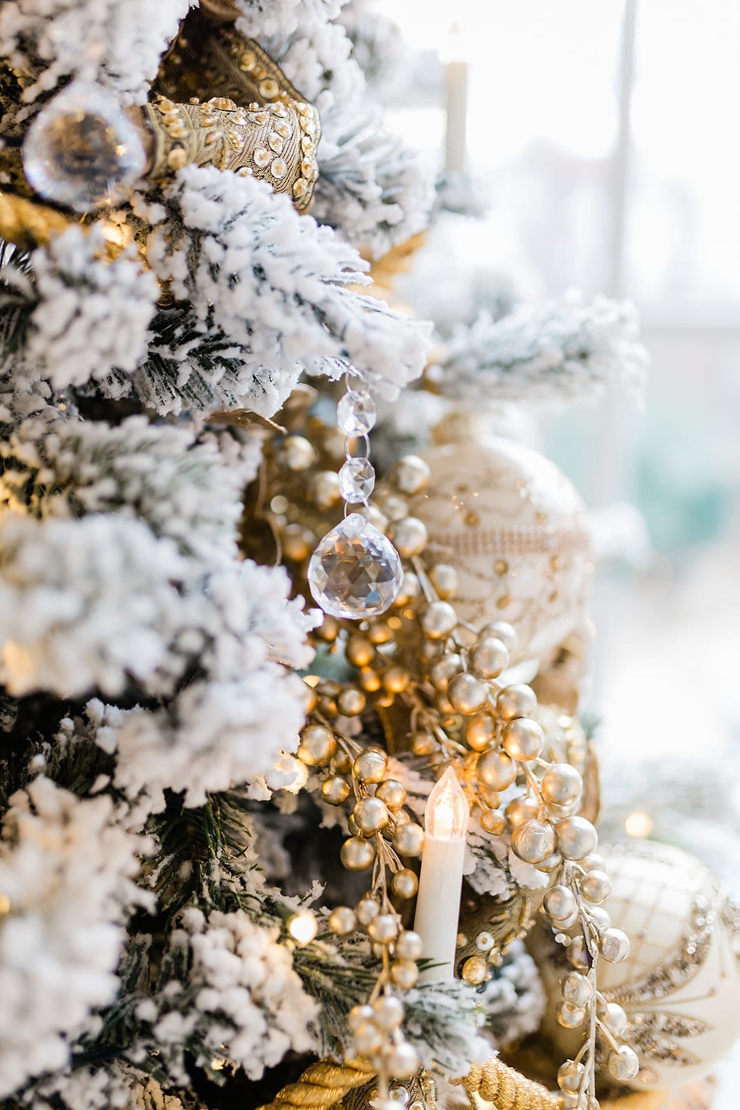 Chandelier Christmas Tree with white and gold Christmas tree decorations.