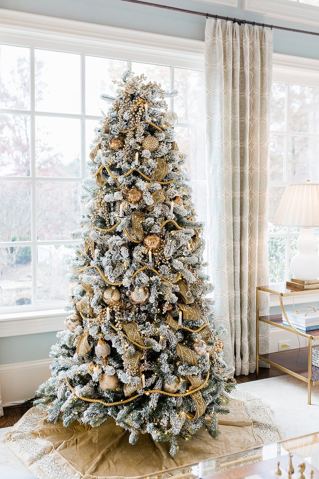 Last year I decorated a Gold Christmas tree for our sunroom. I used opulent Gold Christmas Tree ornaments and Gold Christmas tree decorations for a posh & glam look! I'll share great lookalike options for the Gold Ribbon for Christmas tree, and Gold ornaments so you can recreate it!