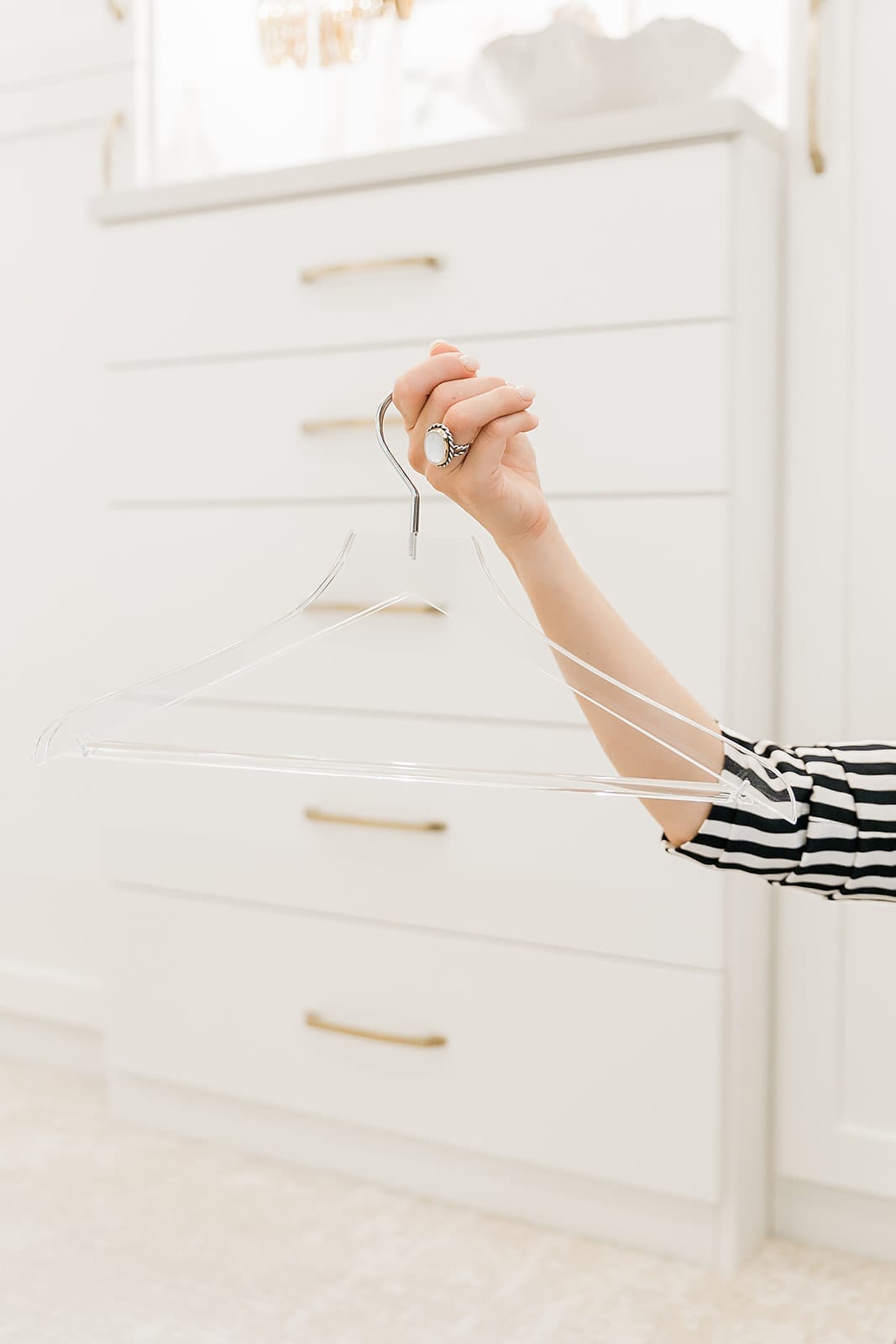 Acrylic hanger from Container Store for updating your closet with accessories.