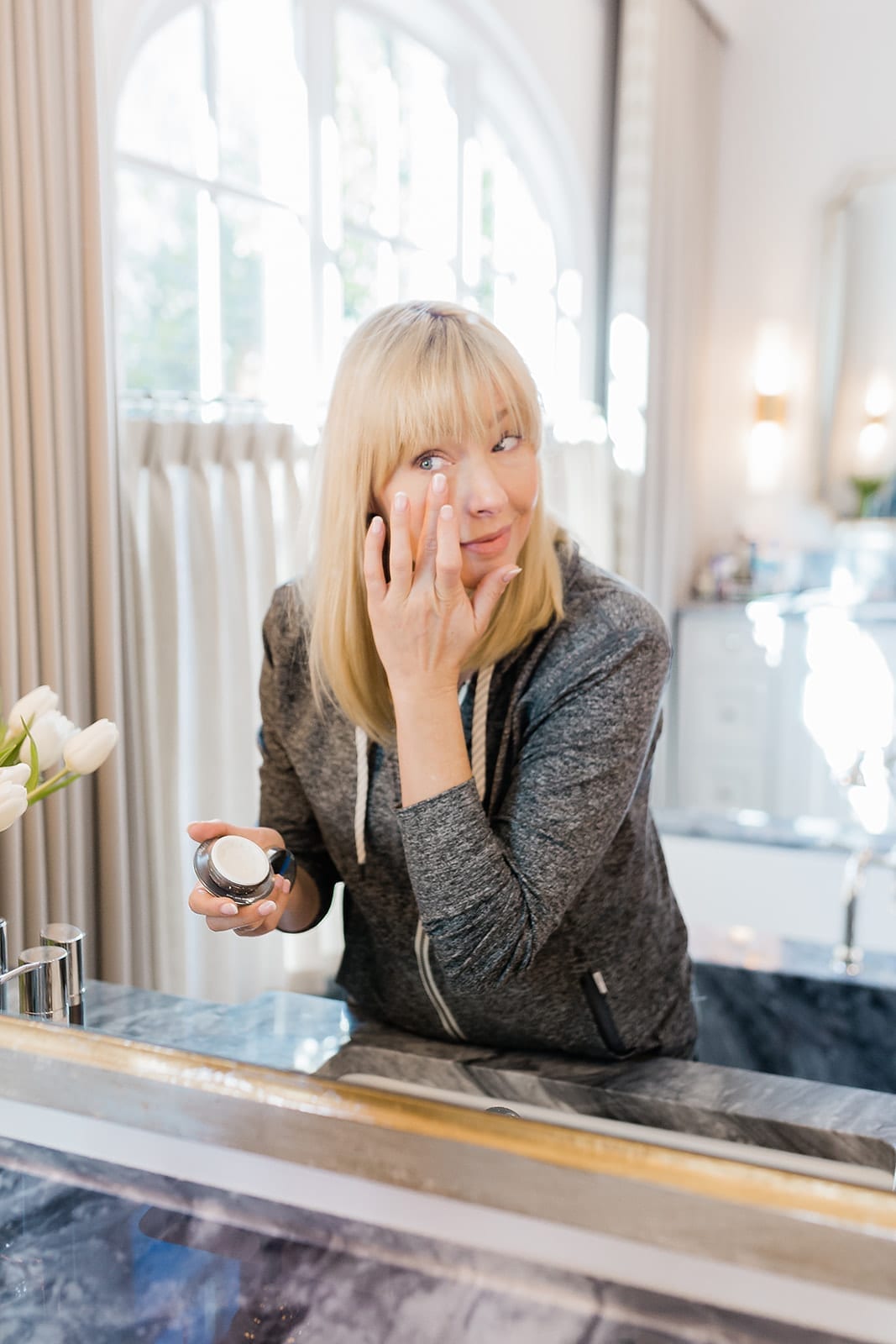 Beauty influencer Kelly Page for BlueGrayGal trying different SkinMedica moisturizers, and sharing the best SkinMedica Moisturizers and applying TNS Eye Repair for a review.