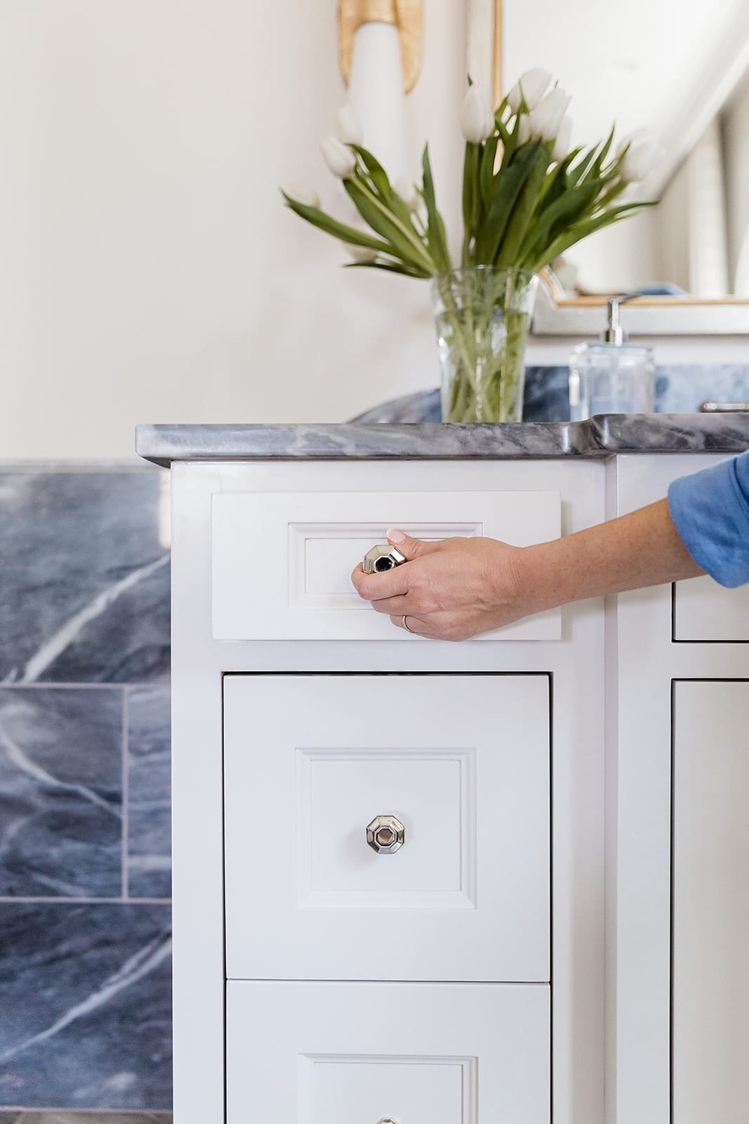 Polished Nickel hardware from VESTA hardware. High end bathroom hardware on white and marble bathroom vanity.