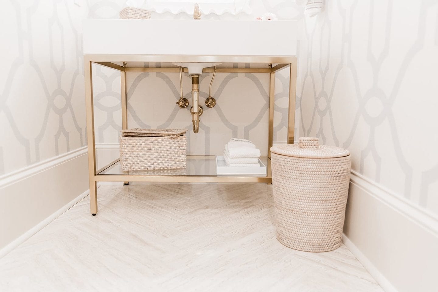 Wicker trash can with Restoration Hardware.