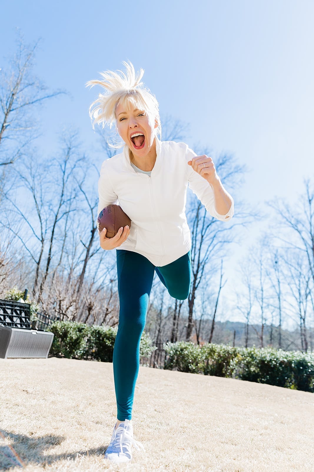 Affordable White Zip Up Pullover for Gym. Great post gym errand running outfit with teal leggings from Amazon and affordable gym long sleeve top.