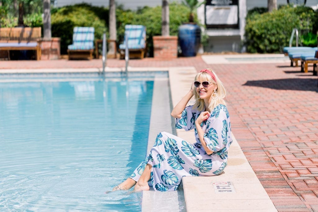 White Amazon Bathing Suit Cover Up with palm leaf print and pink headband from Anthropologie.