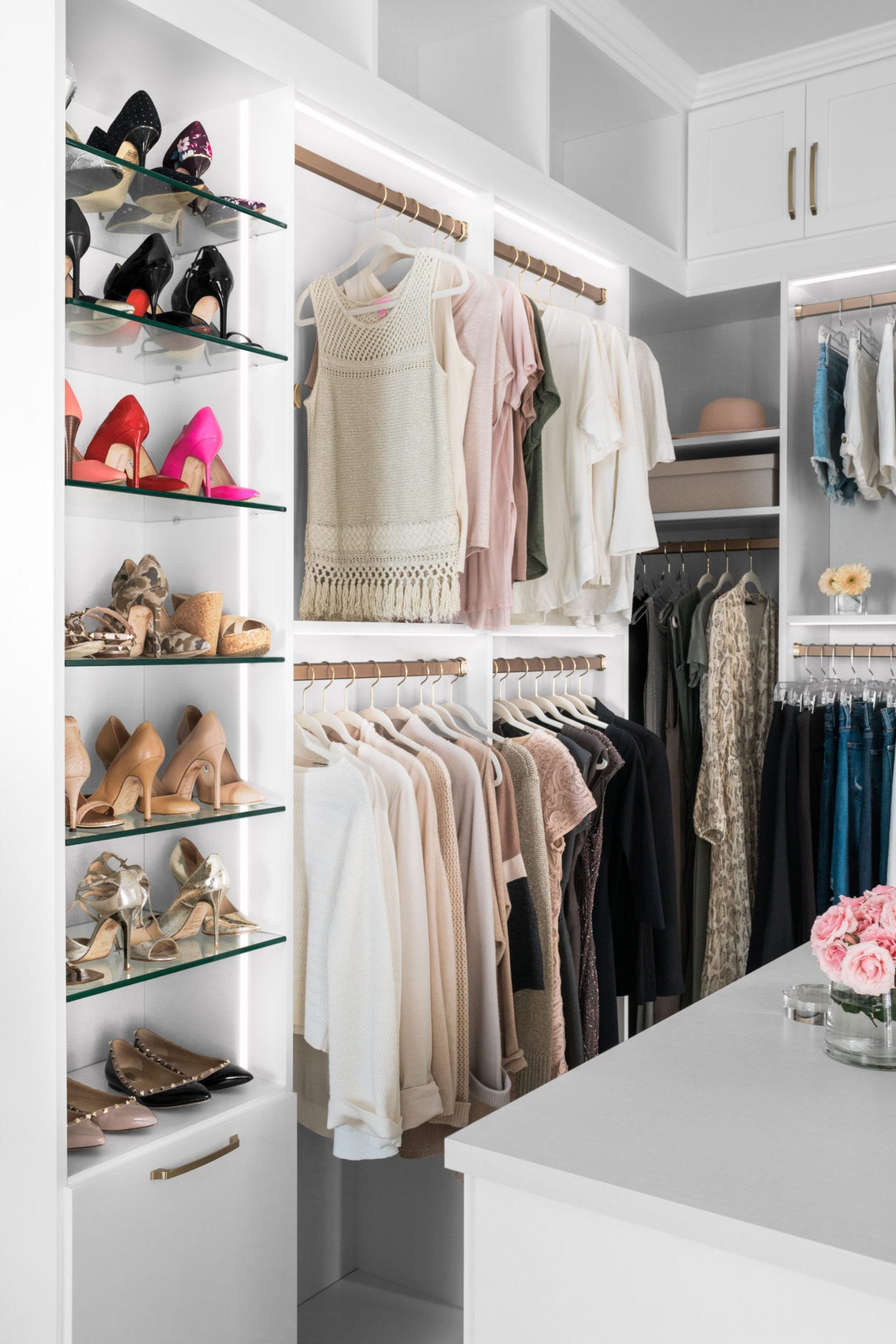 Closet Lighting Ideas in the home of home blogger BlueGrayGal. LED light strips light a shoe display and hanging racks for a retail-like closet.