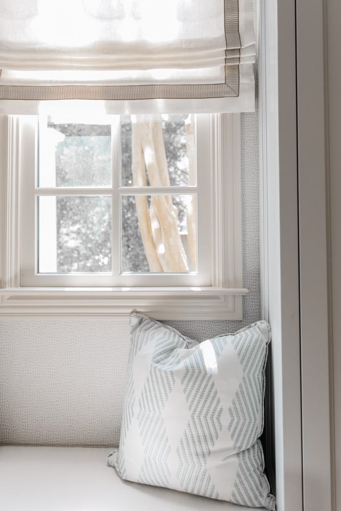 Mudroom organizing ideas. See our mudroom locker cubbies with doors, mudroom bench seat, roman shade and throw pillows all decorated with blue cabinetry, silver lantern pendant and patterned clement tile floor.