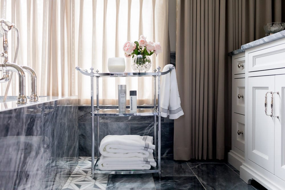 Chrome luxury bathroom accessories set in a bardiglio marble bathroom.