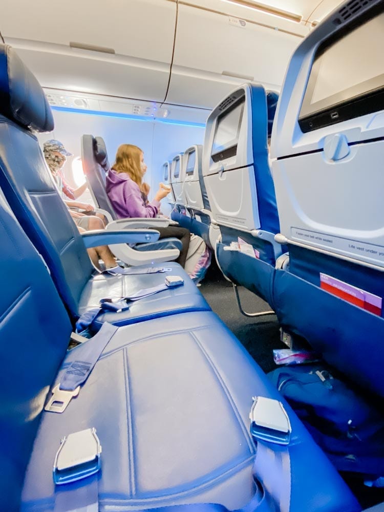 Tips & tricks to flying on Delta during COVID, including how to travel with kids safely during Coronavirus.