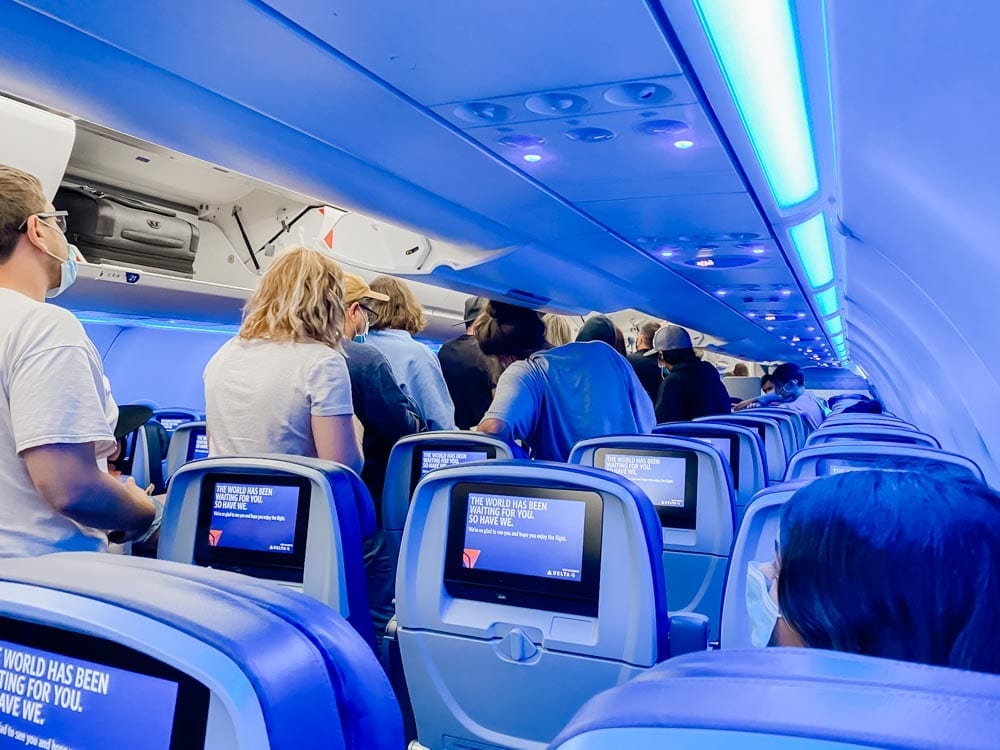 Tips & tricks to flying on Delta during COVID, including how to travel with kids safely during Coronavirus.