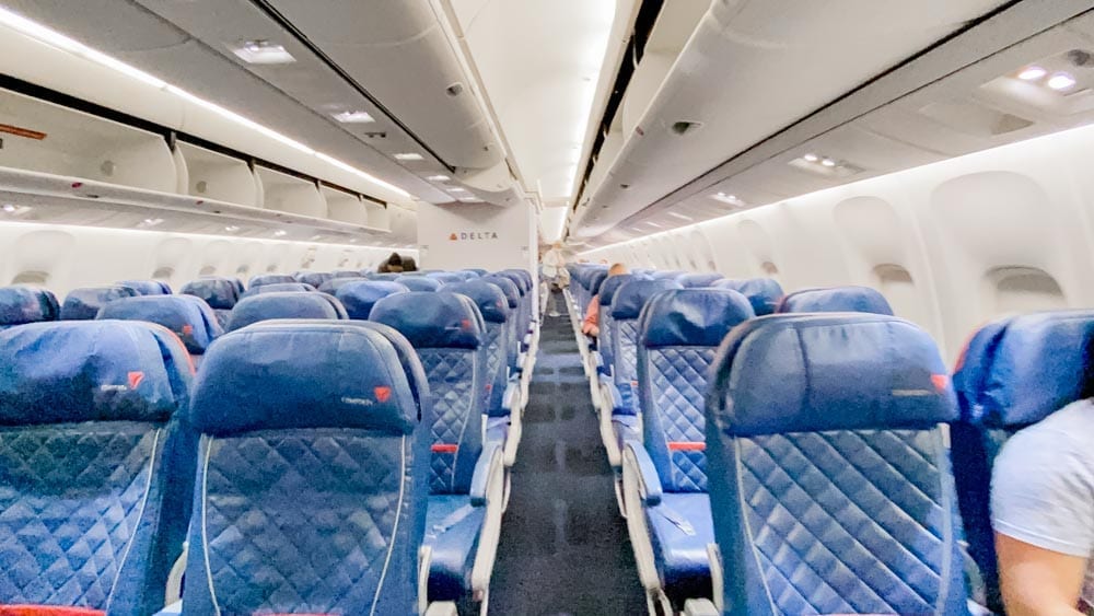 Tips & tricks to flying on Delta during COVID, including how to travel with kids safely during Coronavirus.