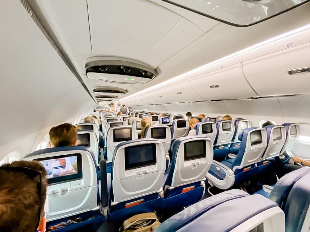 Tips & tricks to flying on Delta during COVID, including how to travel with kids safely during Coronavirus.