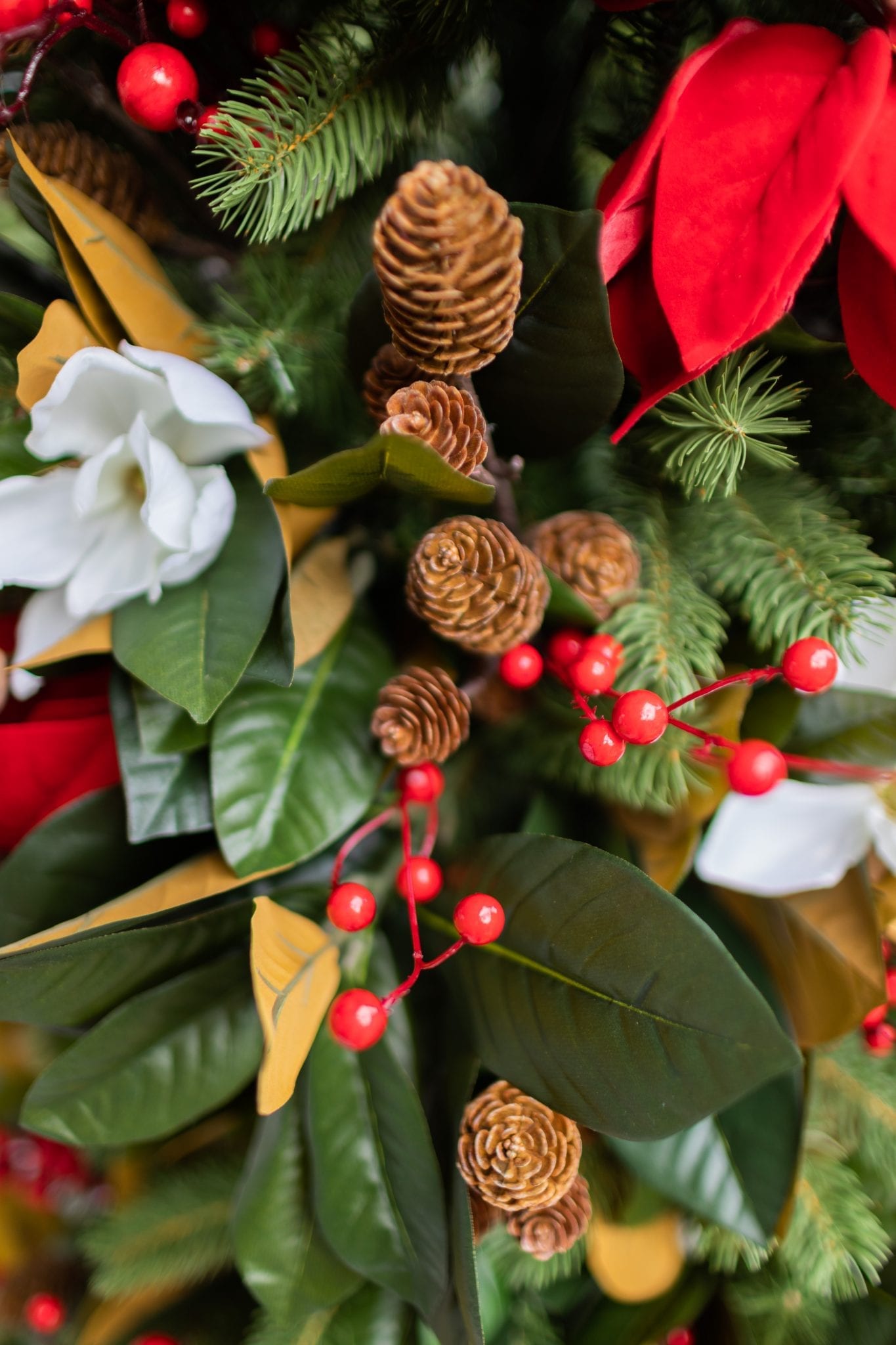 To create a simply southern Christmas, you need basic ingredients: magnolia, poinsettia & a bit of the outdoors! This magnolia tree is beautiful both inside or for balcony christmas decorations! If you need Christmas balcony ideas, this tree along with artificial poinsettia plants for outside may be just the ticket!