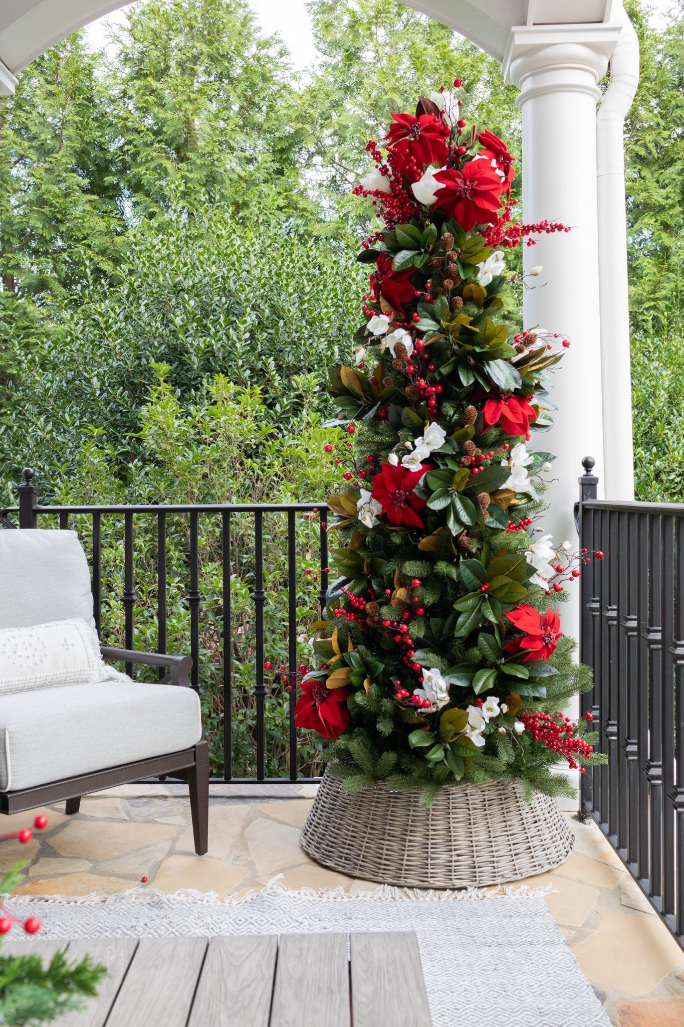 To create a simply southern Christmas, you need basic ingredients: magnolia, poinsettia & a bit of the outdoors! This magnolia tree is beautiful both inside or for balcony christmas decorations! If you need Christmas balcony ideas, this tree along with artificial poinsettia plants for outside may be just the ticket!