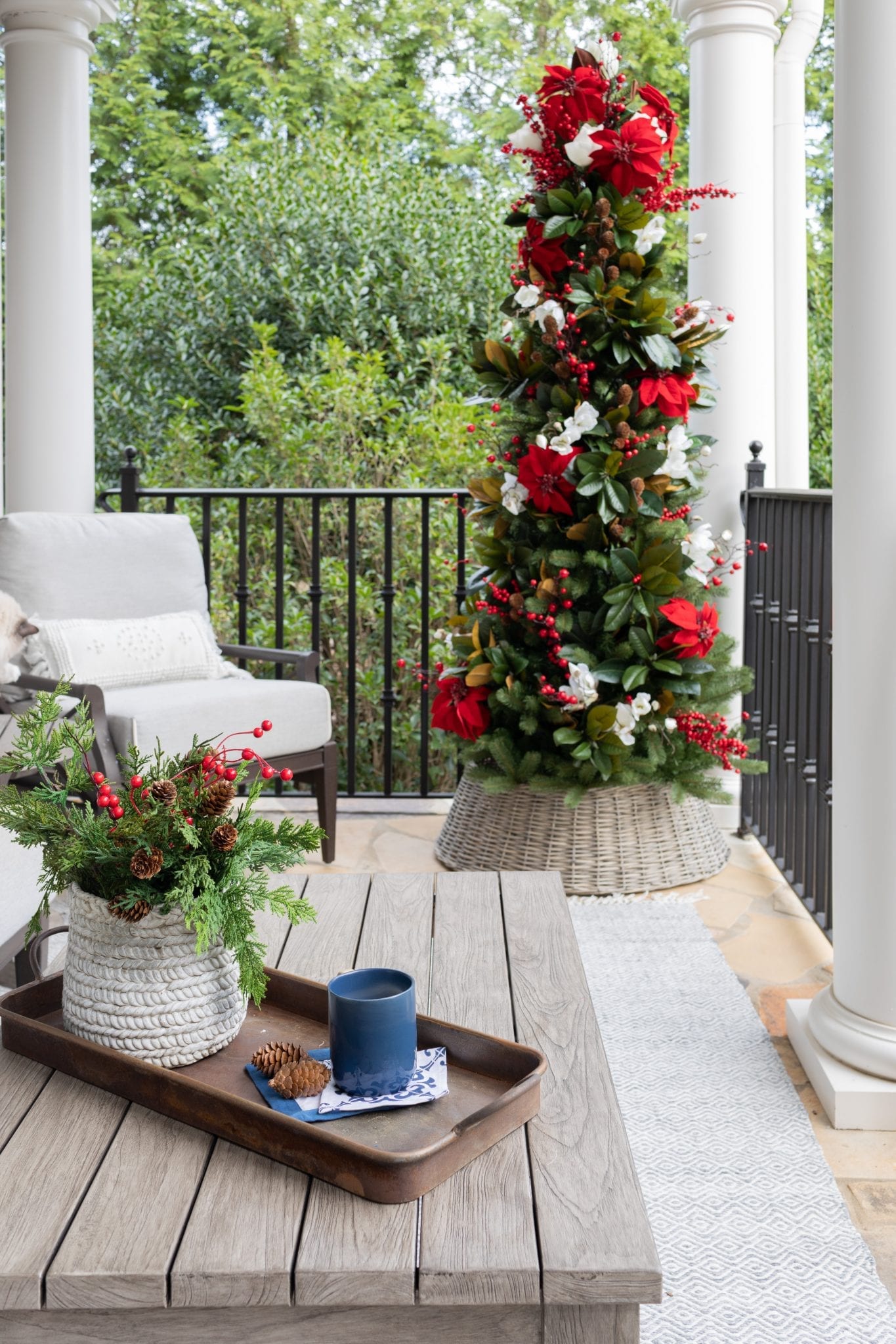 To create a simply southern Christmas, you need basic ingredients: magnolia, poinsettia & a bit of the outdoors! This magnolia tree is beautiful both inside or for balcony christmas decorations! If you need Christmas balcony ideas, this tree along with artificial poinsettia plants for outside may be just the ticket!