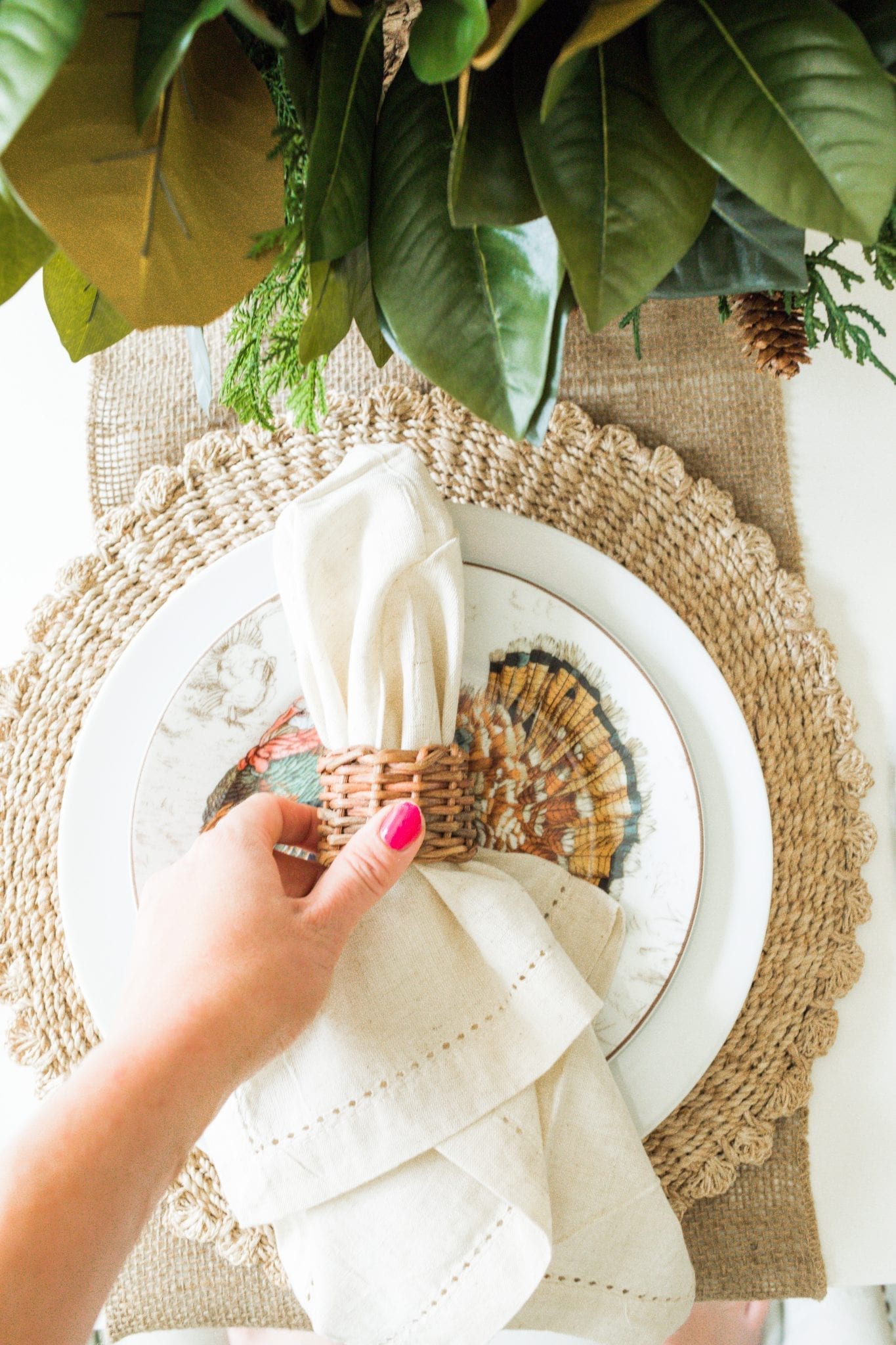 Wicker Placemat mixed with Williams Sonoma Thanksgiving plates, linen napkins and wicker placemats and napkin ring.