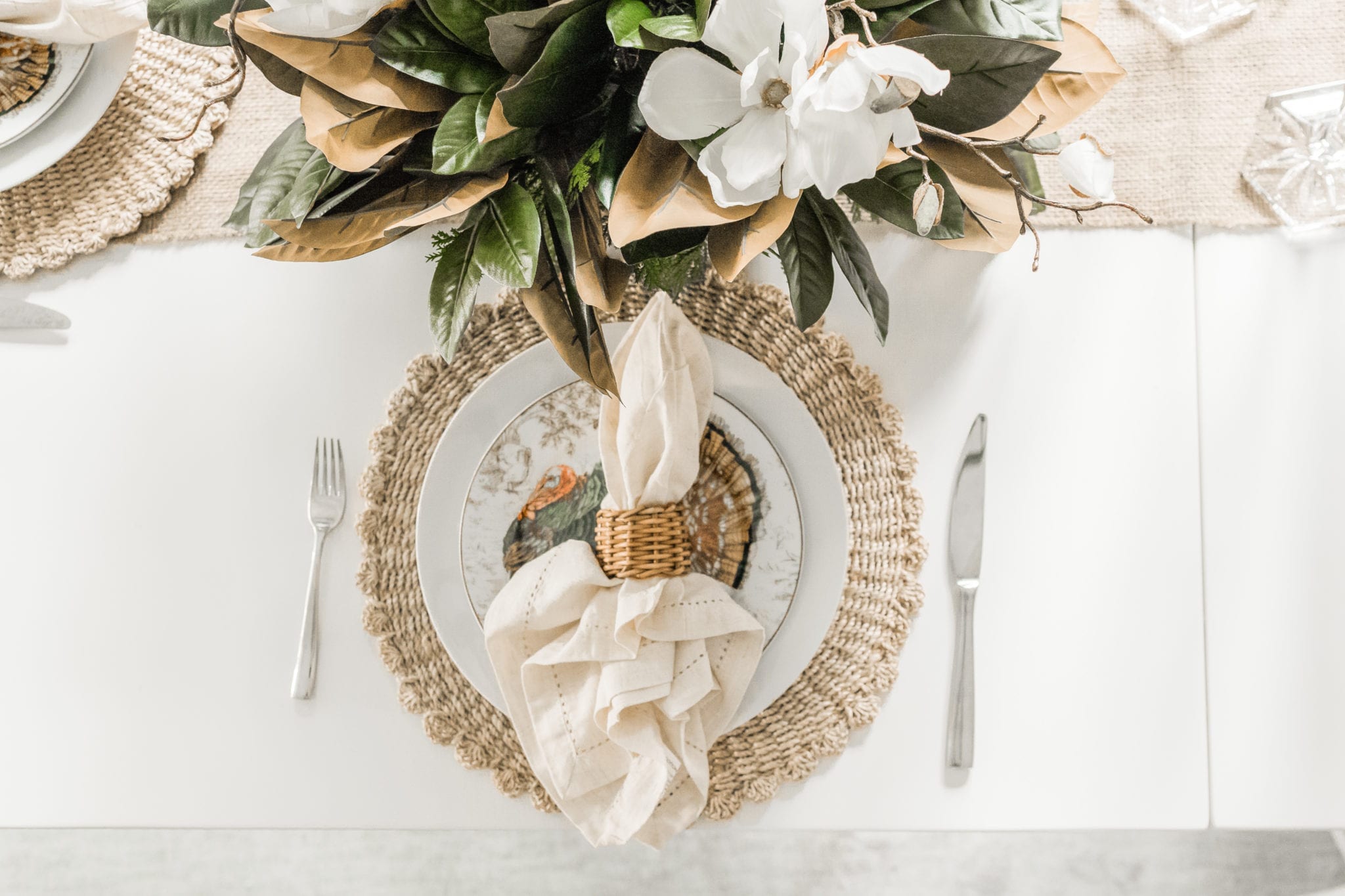 Wicker Placemat mixed with Williams Sonoma Thanksgiving plates, linen napkins and wicker napkin ring.