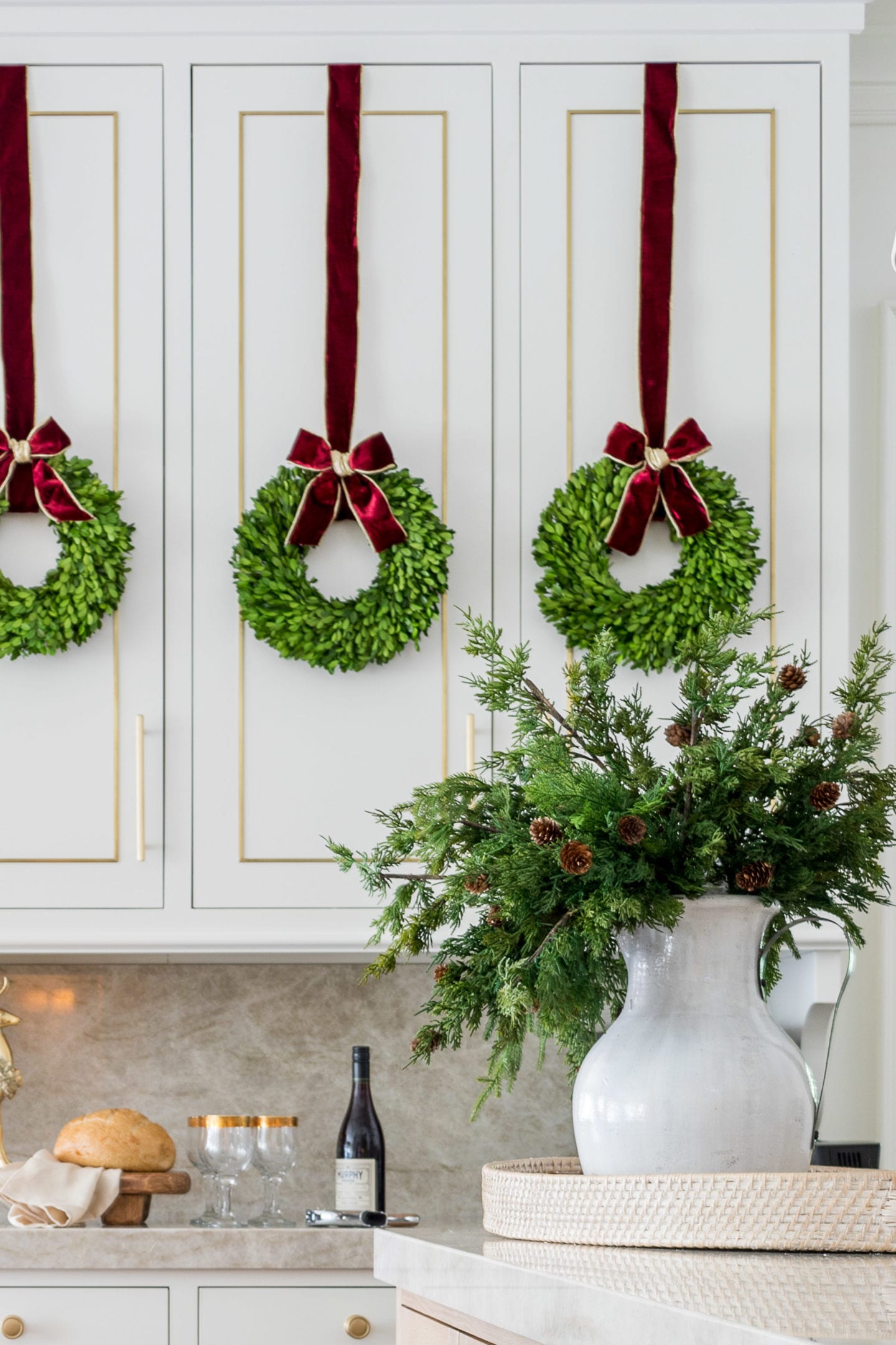 Fresh greenery in the kitchen is beautiful, but who has time these days? I discovered the best faux greenery garland. I mixed faux cedar garland to make a perfectly imperfect farmhouse garland feel. The best faux cedar garland is so life-like it feels almost damp feel! A beautiful look that will last all holiday long!