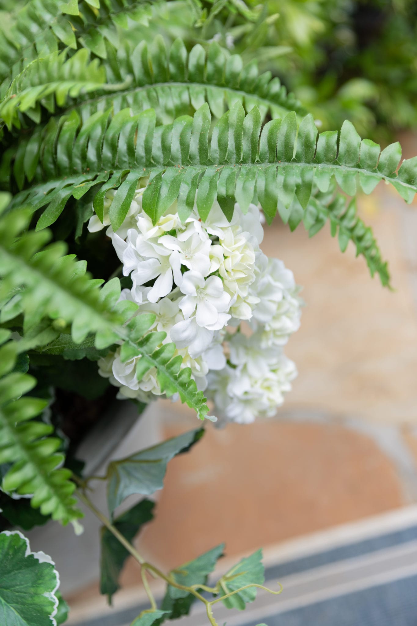 White outdoor artificial flowers in pots