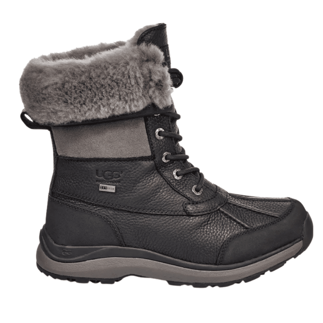 Faux fur lined waterproof UGG bootie in charcoal black. These designer winter boots are perfect for the intense winter cold.