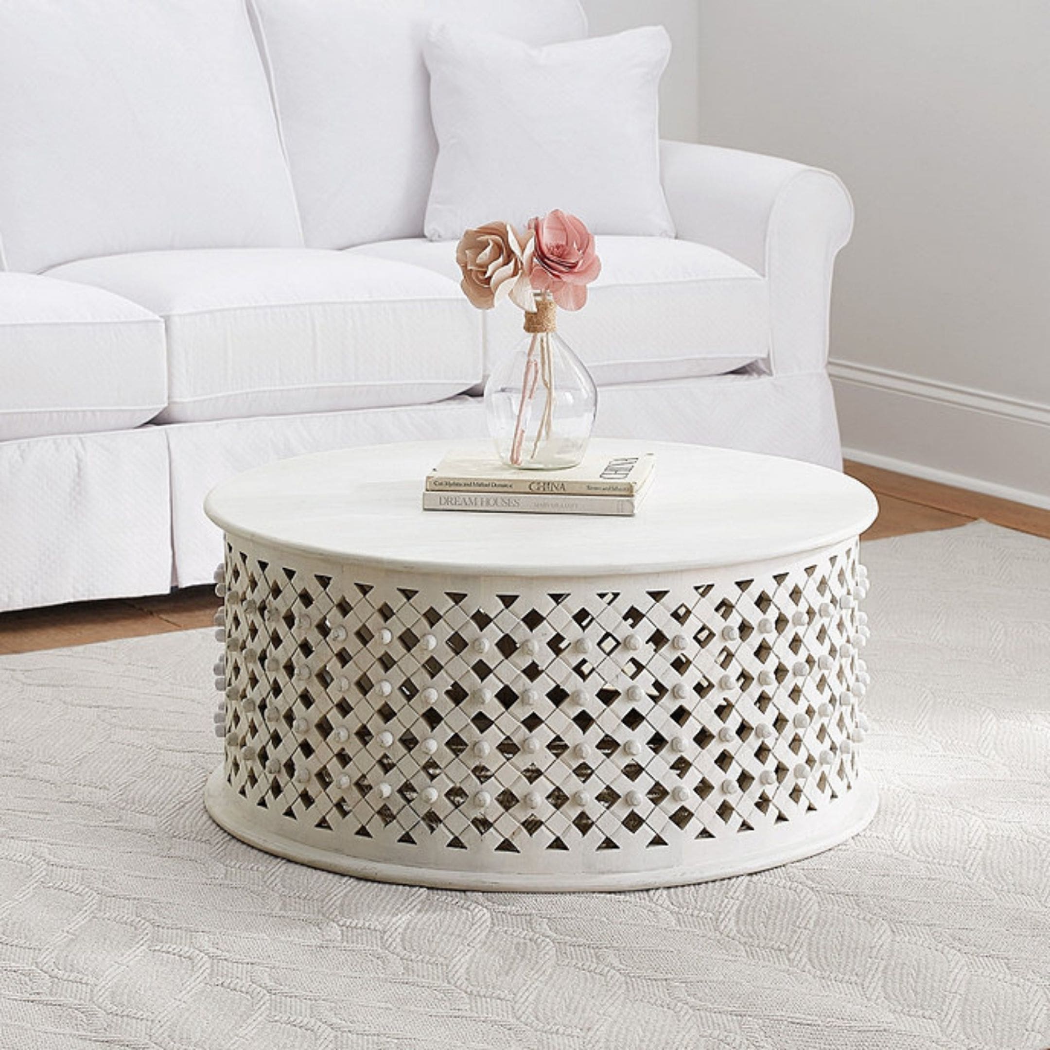 Round white wicker coffee table by Ballard Designs