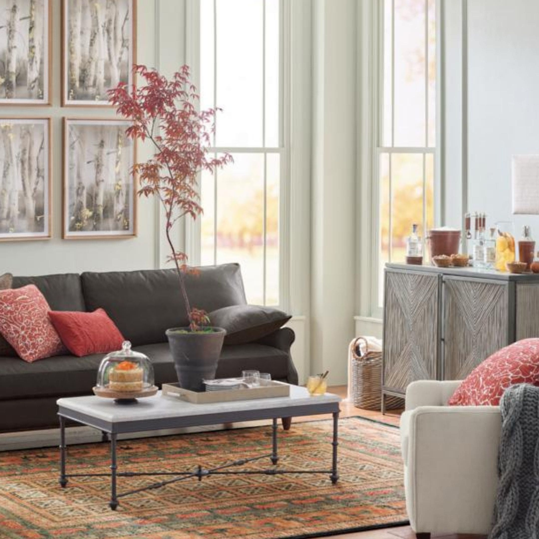 Marble coffee table with metal legs and stone top.