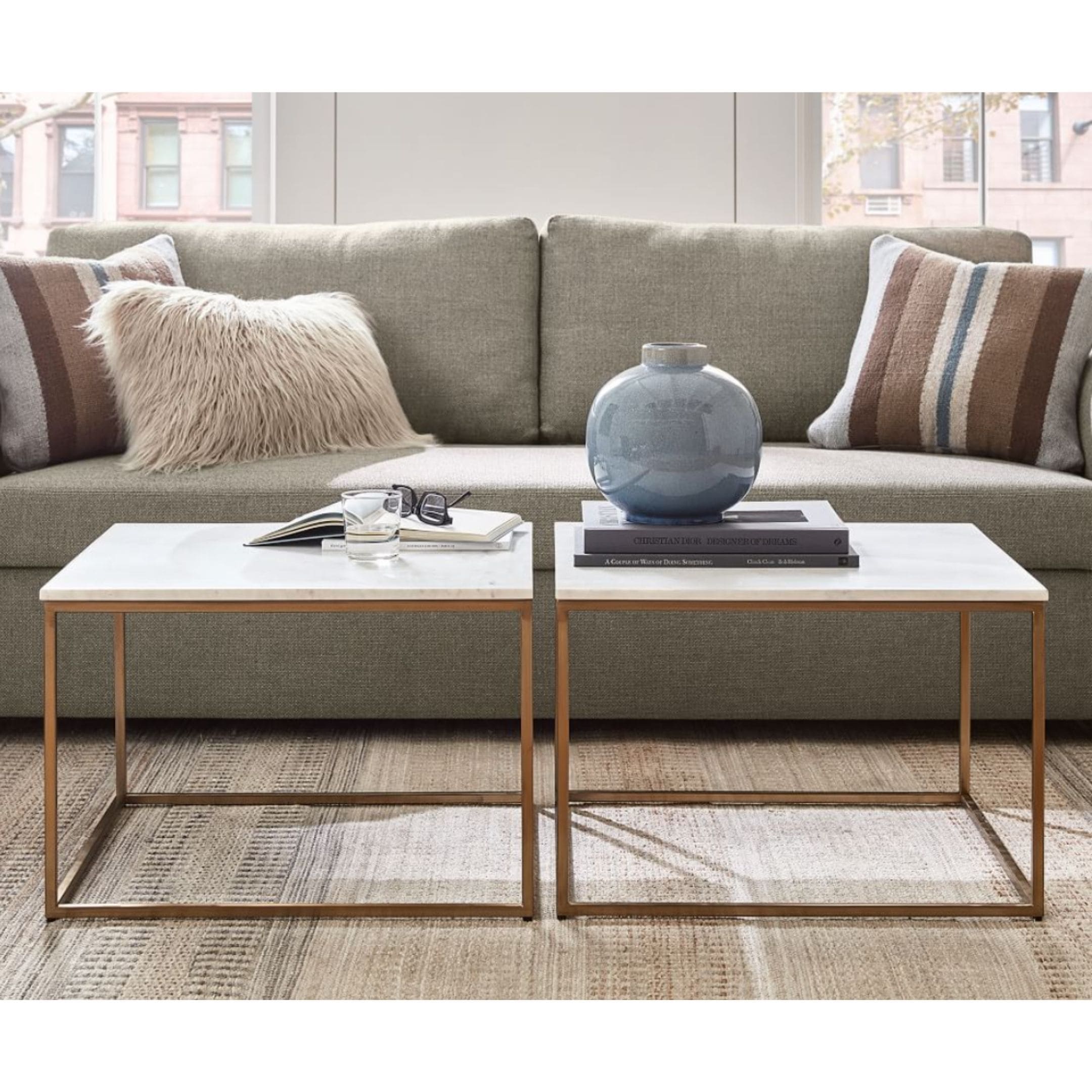 Stone coffee tables with metal legs.