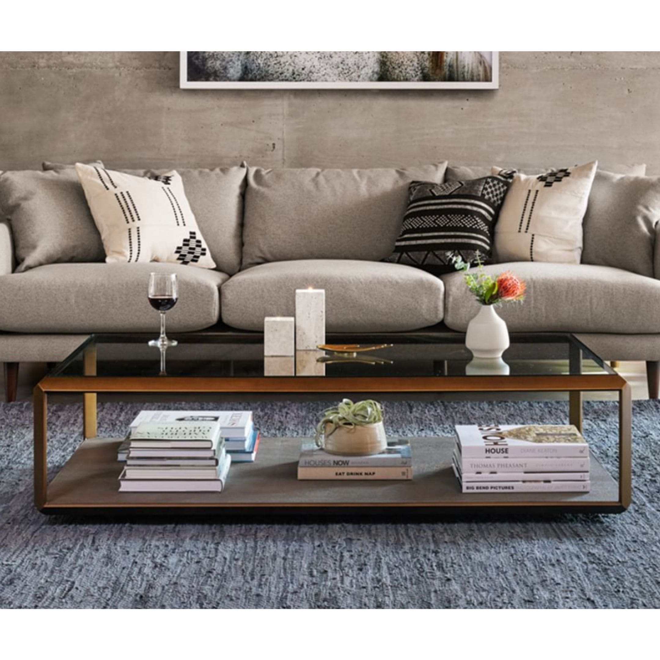 Pottery Barn rectangle coffee table with glass topper and storage underneath.
