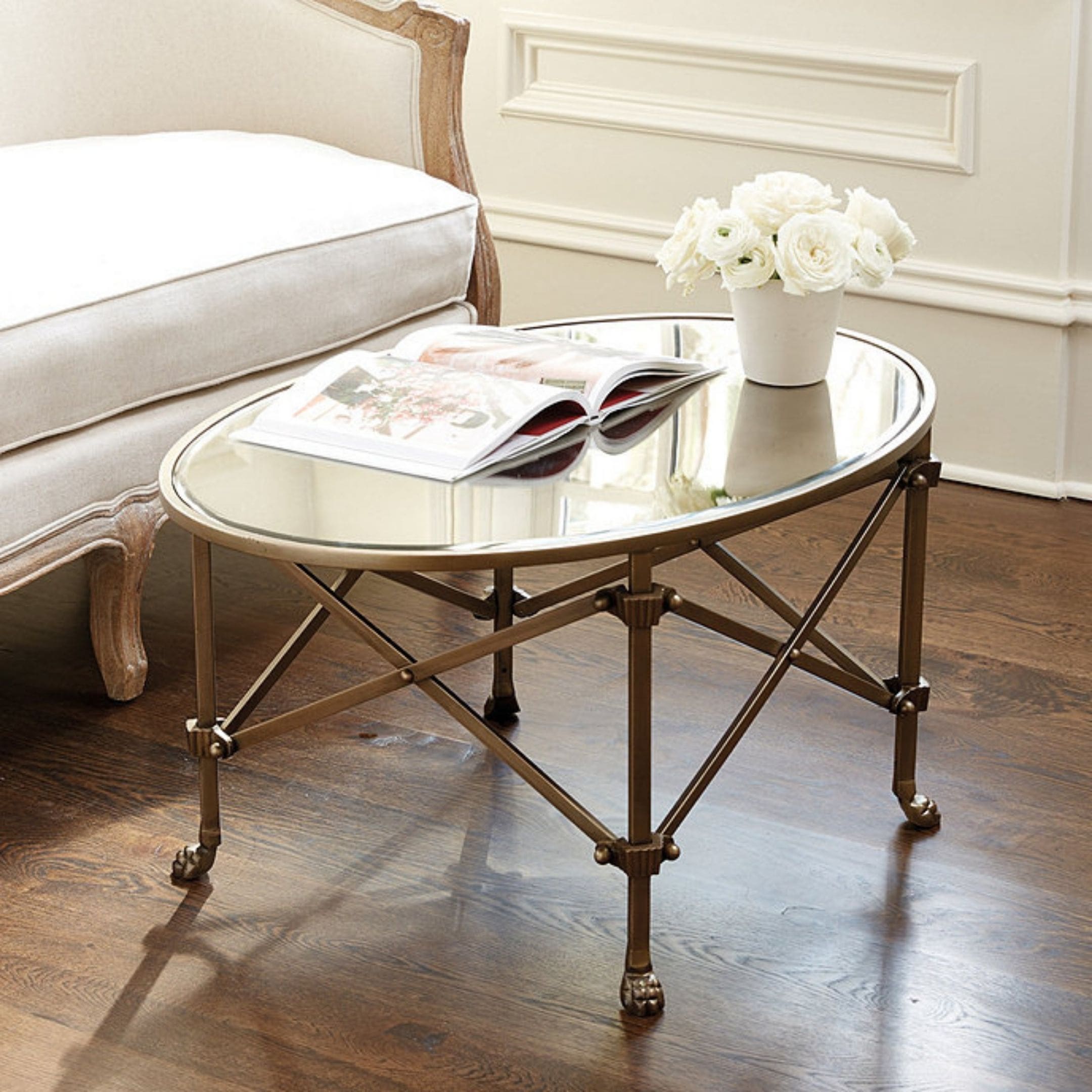 Mirrored Coffee Table with glass top and vintage brass legs.