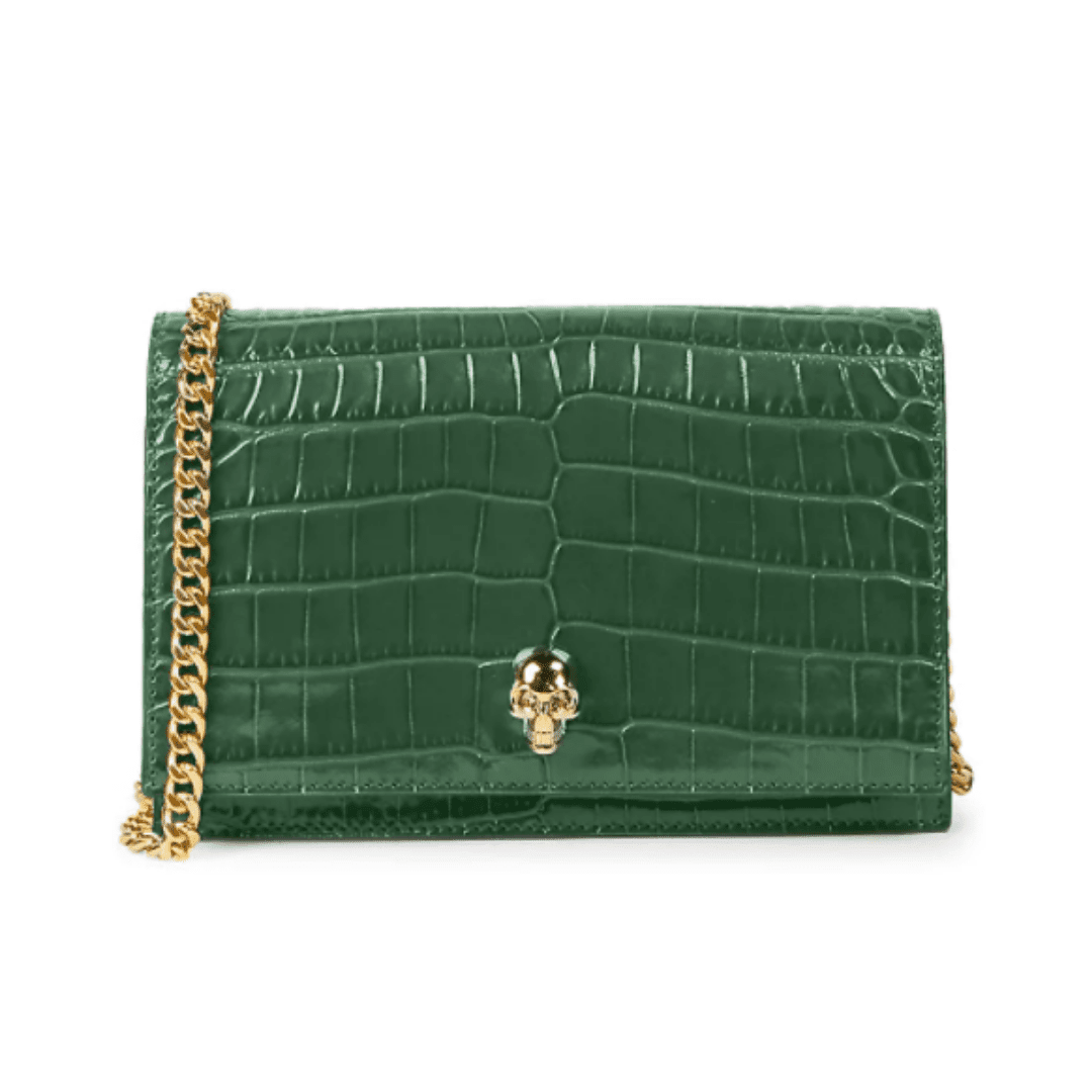Alexander McQueen green shoulder bag with crocodile design and gold chain strap.